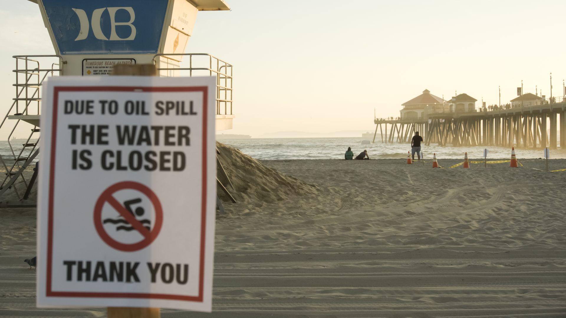 A warning sign for an oil spill in Huntington Beach
