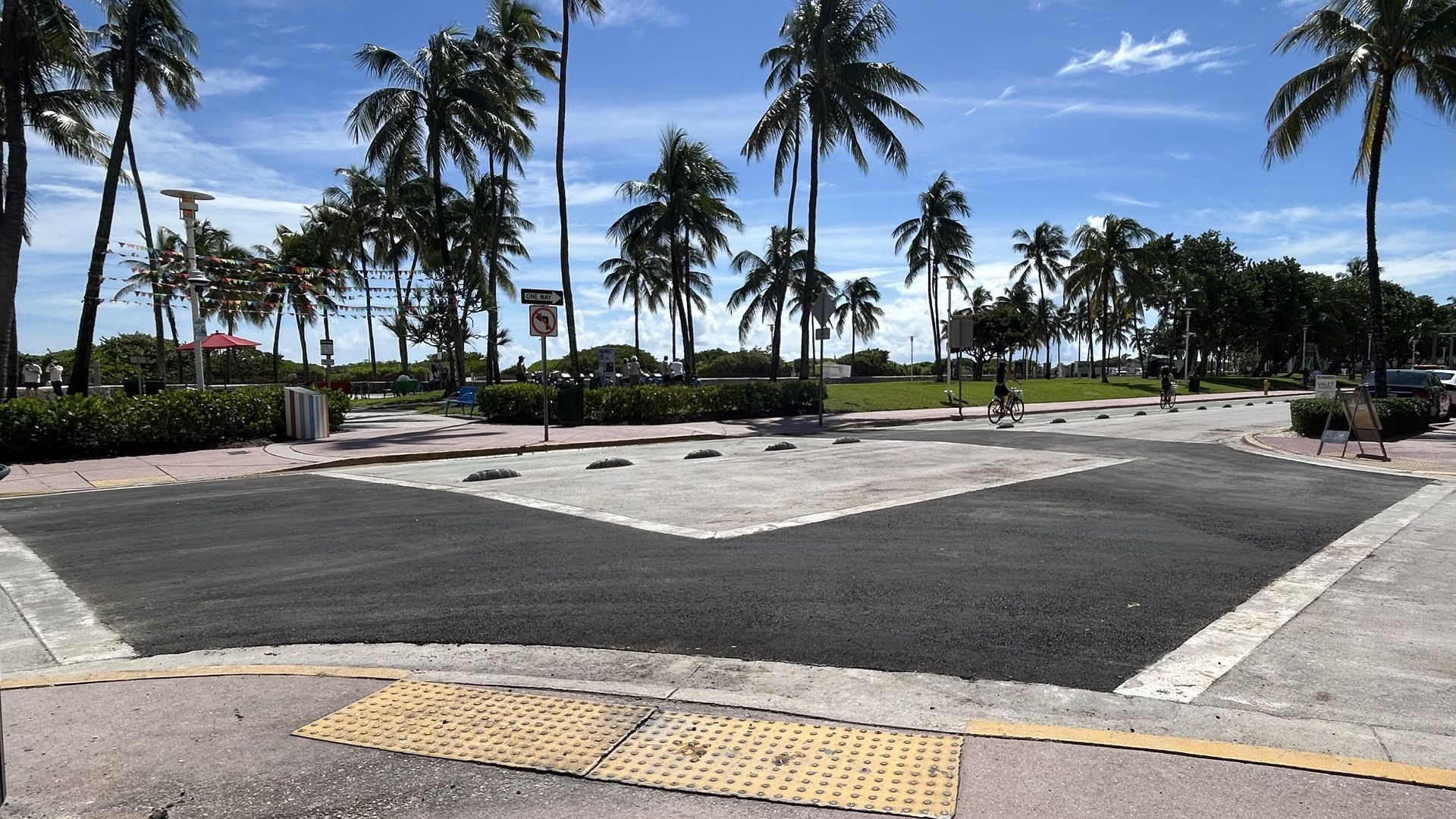 Miami Beach crosswalk is painted black. 