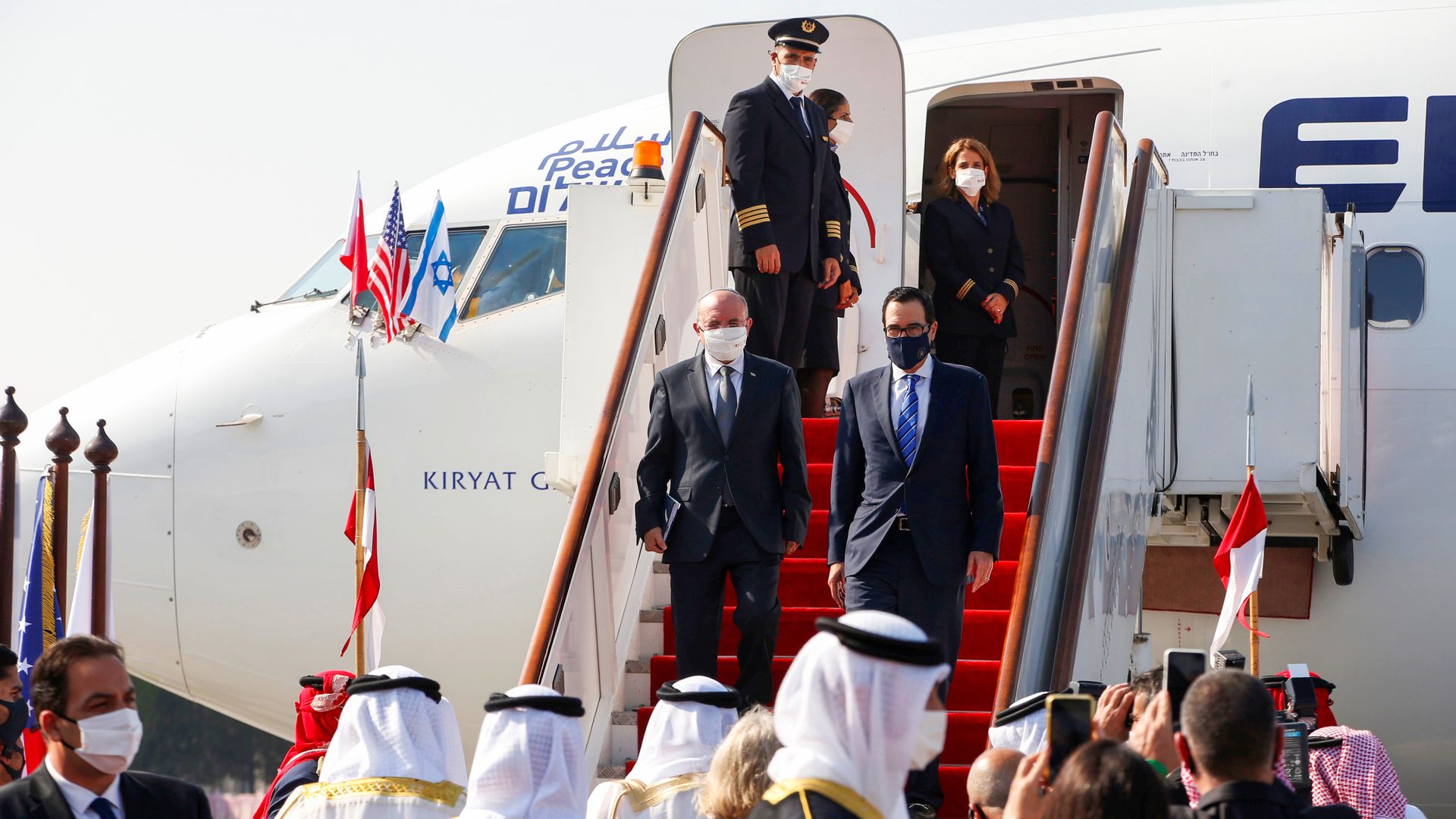 Treasury Secretary Steven Mnuchin walking down airplane stairs 