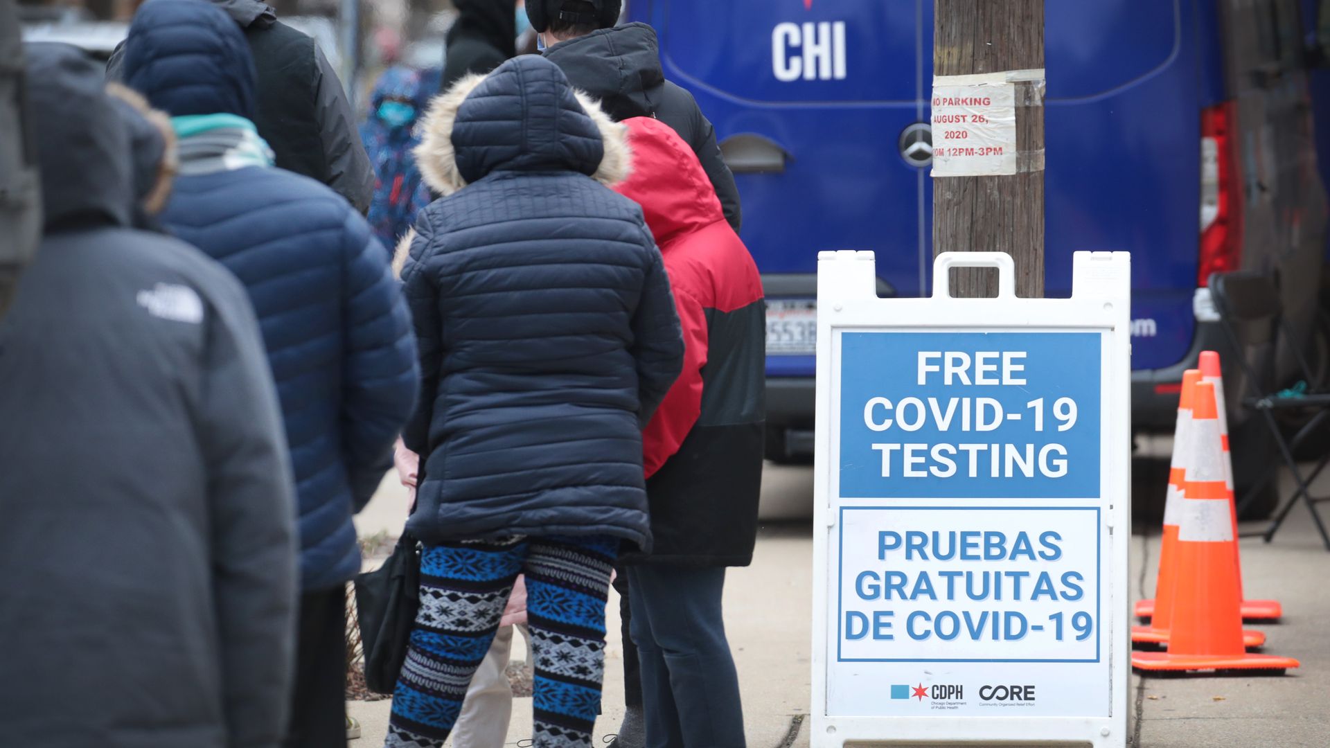 People stand in line for COVID testing