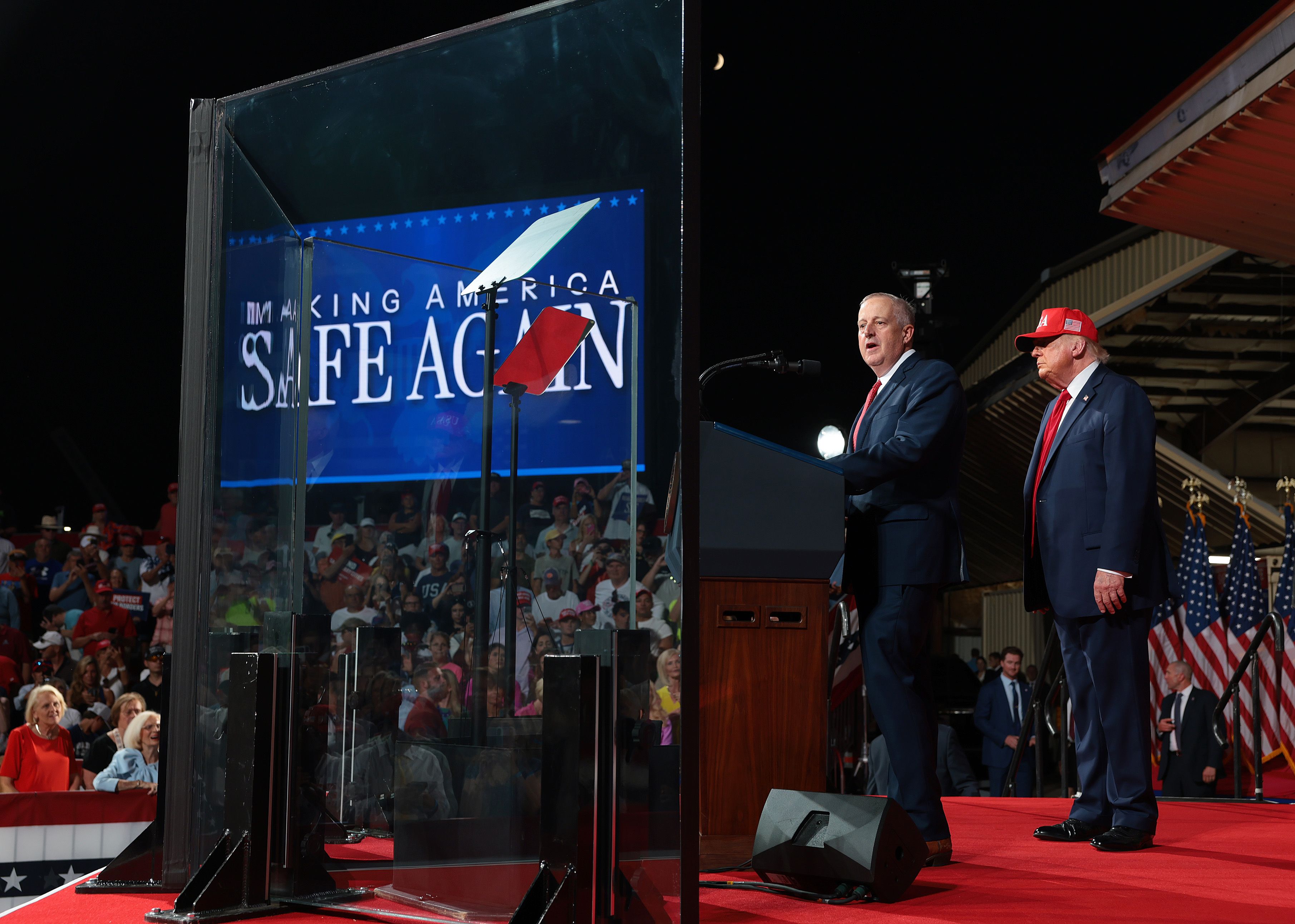 North Carolina Republican Senate candidate and former RNC Chairman Michael Whatley (L) speaks as U.S. President Donald Trump (R) looks on during a campaign rally at Gastonia Municipal Airport on September 16, 2026 in Gastonia, North Carolina