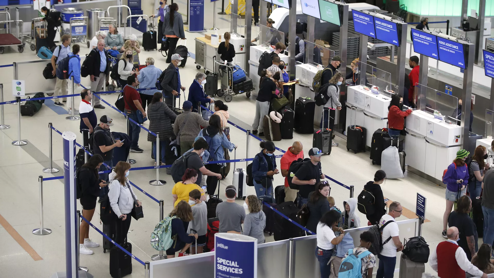A line of people at Logan airport