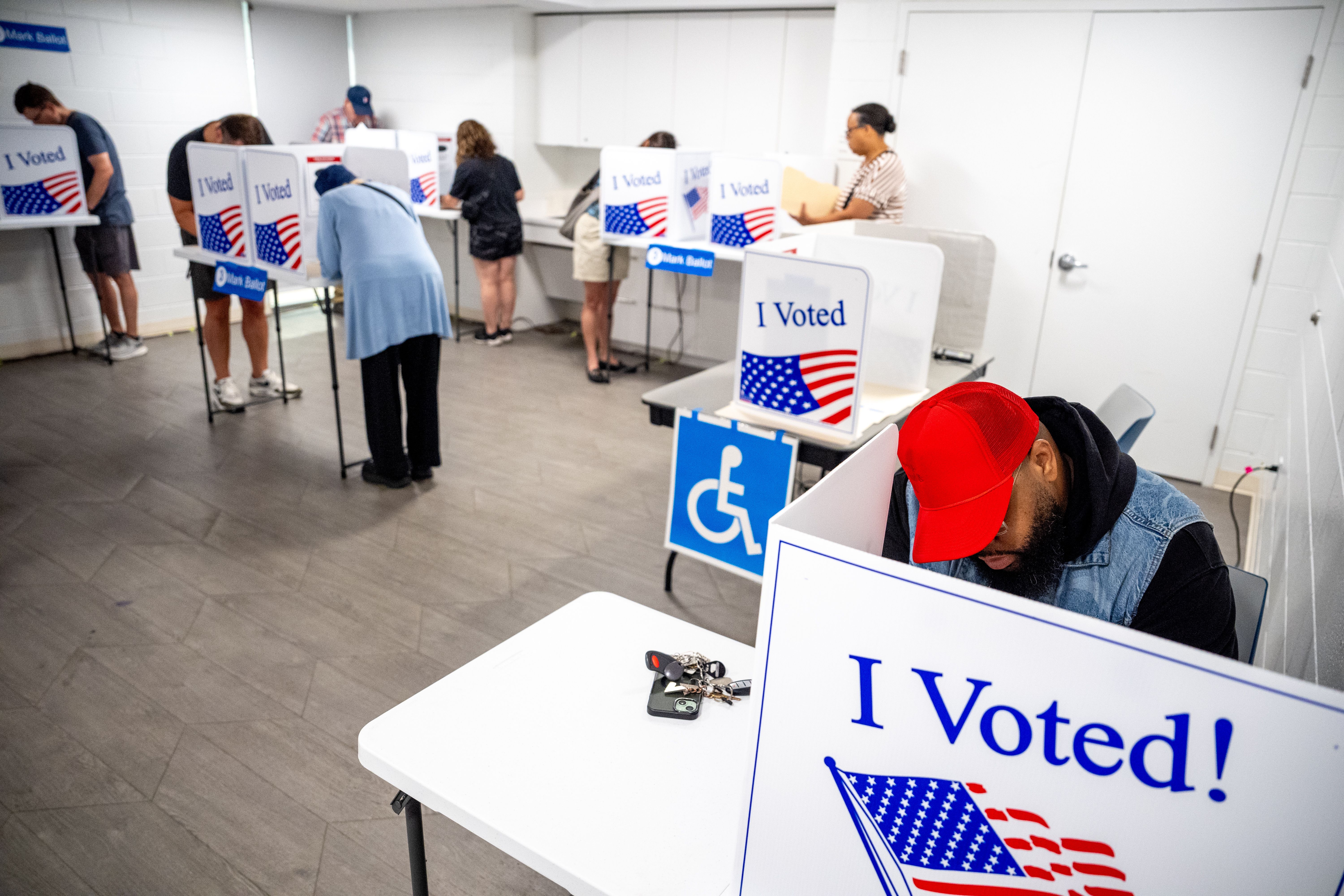 People vote on the first day of Virginia's in-person early voting at Long Bridge Park Aquatics and Fitness Center on September 20, 2024 in Arlington, Virginia. Ballots have started being cast for the presidential race and local elections in Virginia, Minnesota and South Dakota. (Photo by Andrew Harn