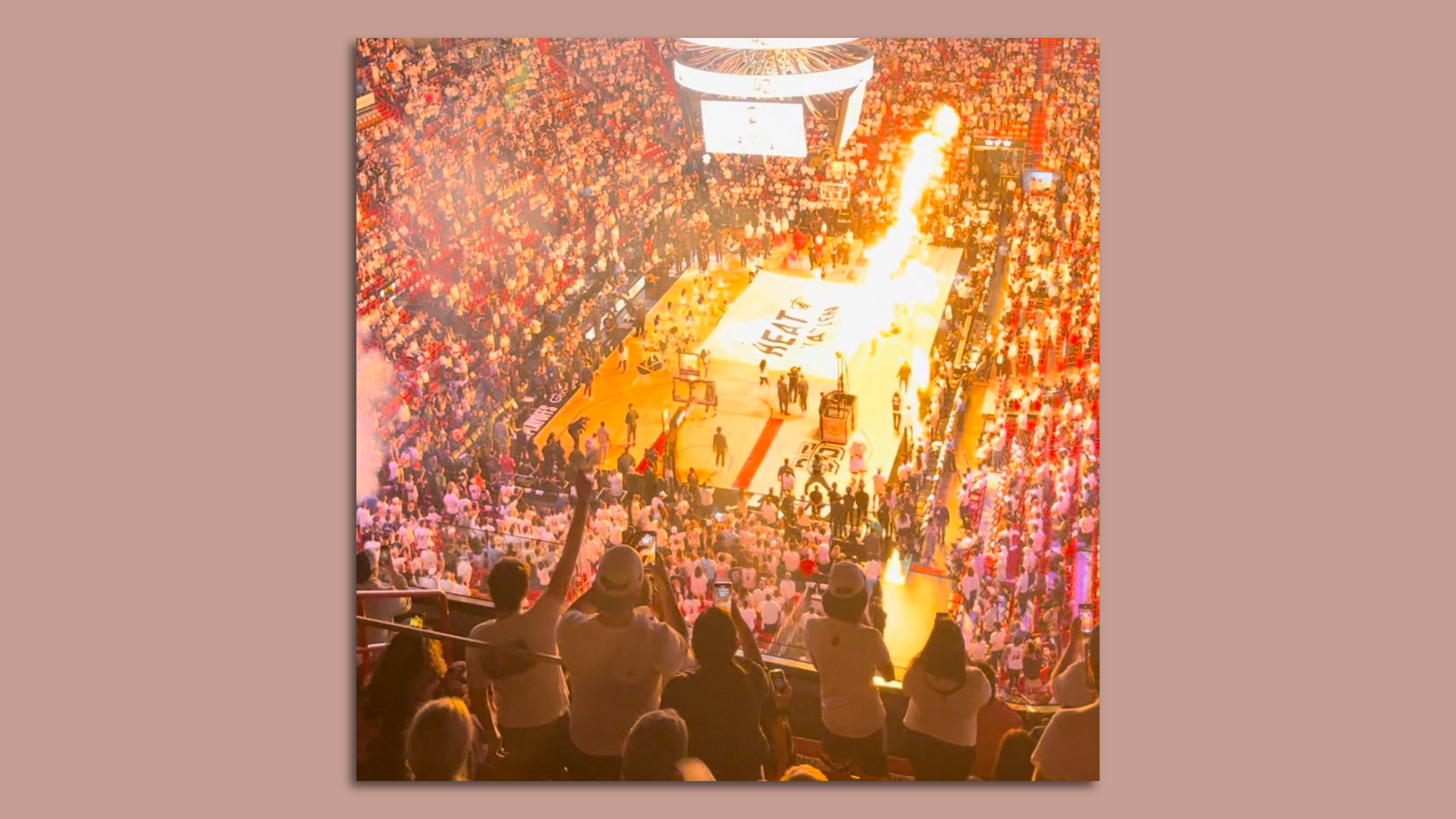 Miami Heat fans cheer on the team during the opening pyrotechnics display at the Kaseya Center.