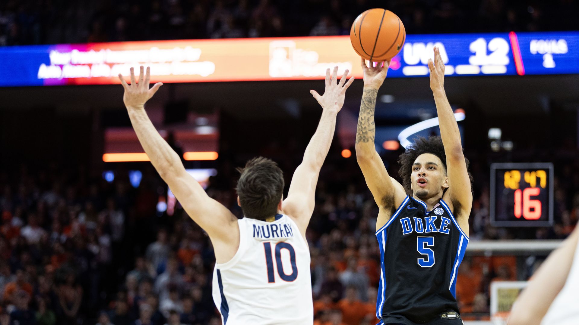 Tyrese Proctor #5 of the Duke Blue Devils shoots over Taine Murray #10 of the Virginia Cavaliers in the first half during a game at John Paul Jones Arena on February 17, 2025 in Charlottesville, Virginia. (Photo by Ryan M. Kelly/Getty Images)