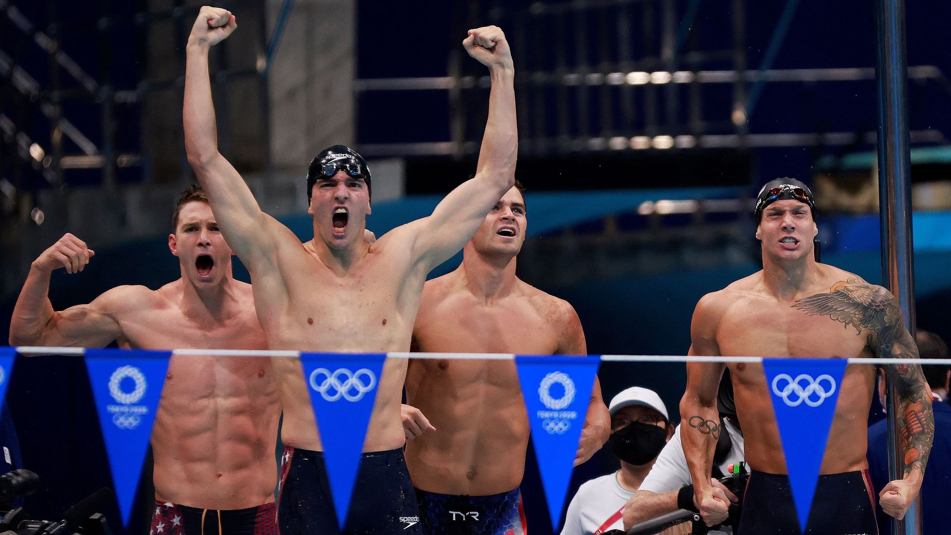 USA's Ryan Murphy,Zach Apple,  Michael Andrew and Caeleb Dressel celebrate winning gold in the final of the men's 4x100m medley relay swimming event during the Tokyo 2020 Olympic Games 