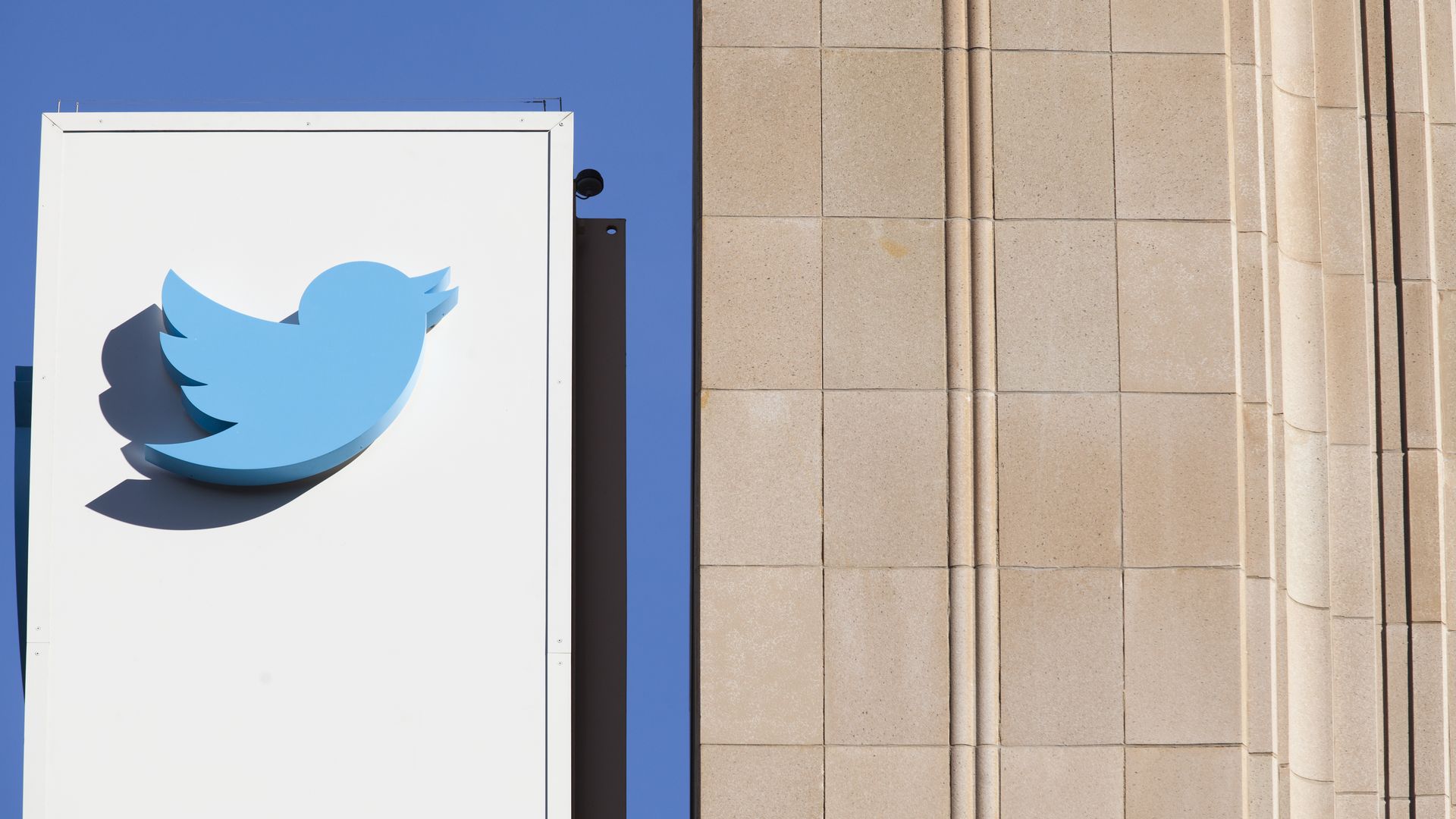 The Twitter logo on a sign outside of company HQ