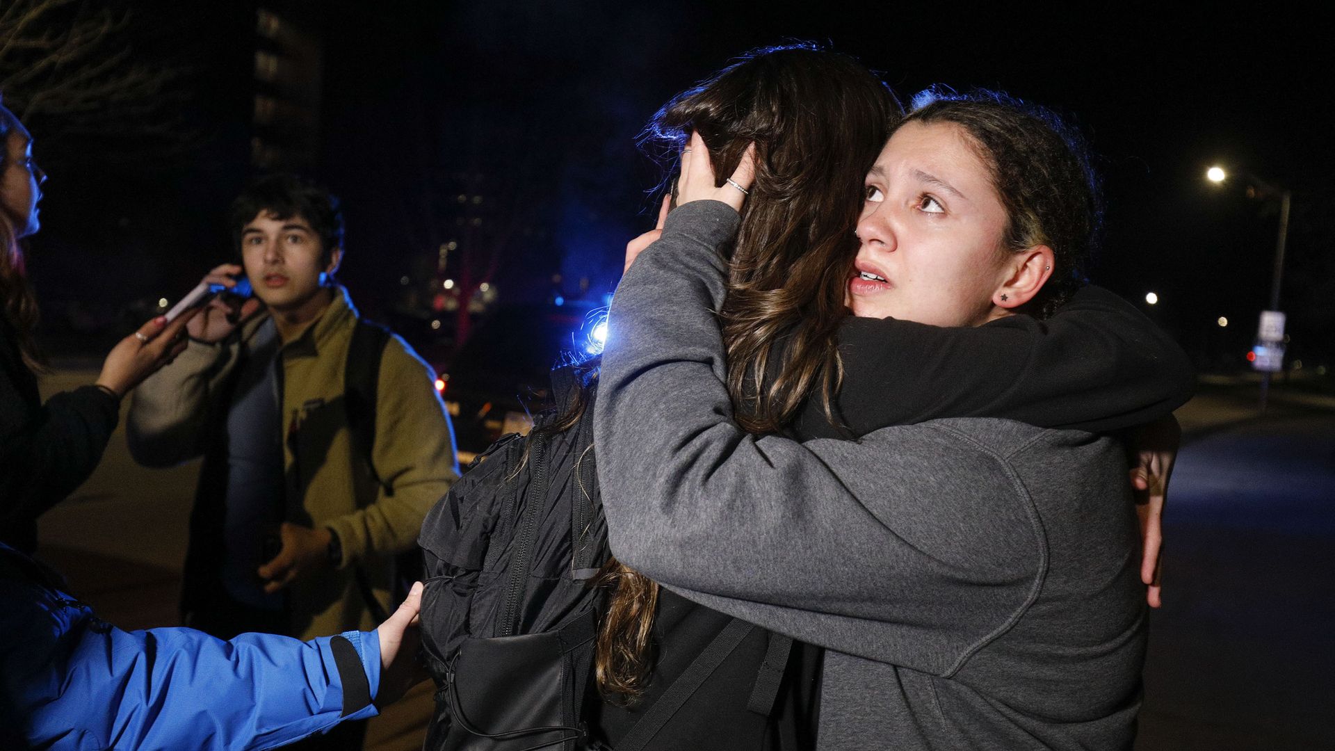 MSU students hug during an active shooter situation on campus Monday.