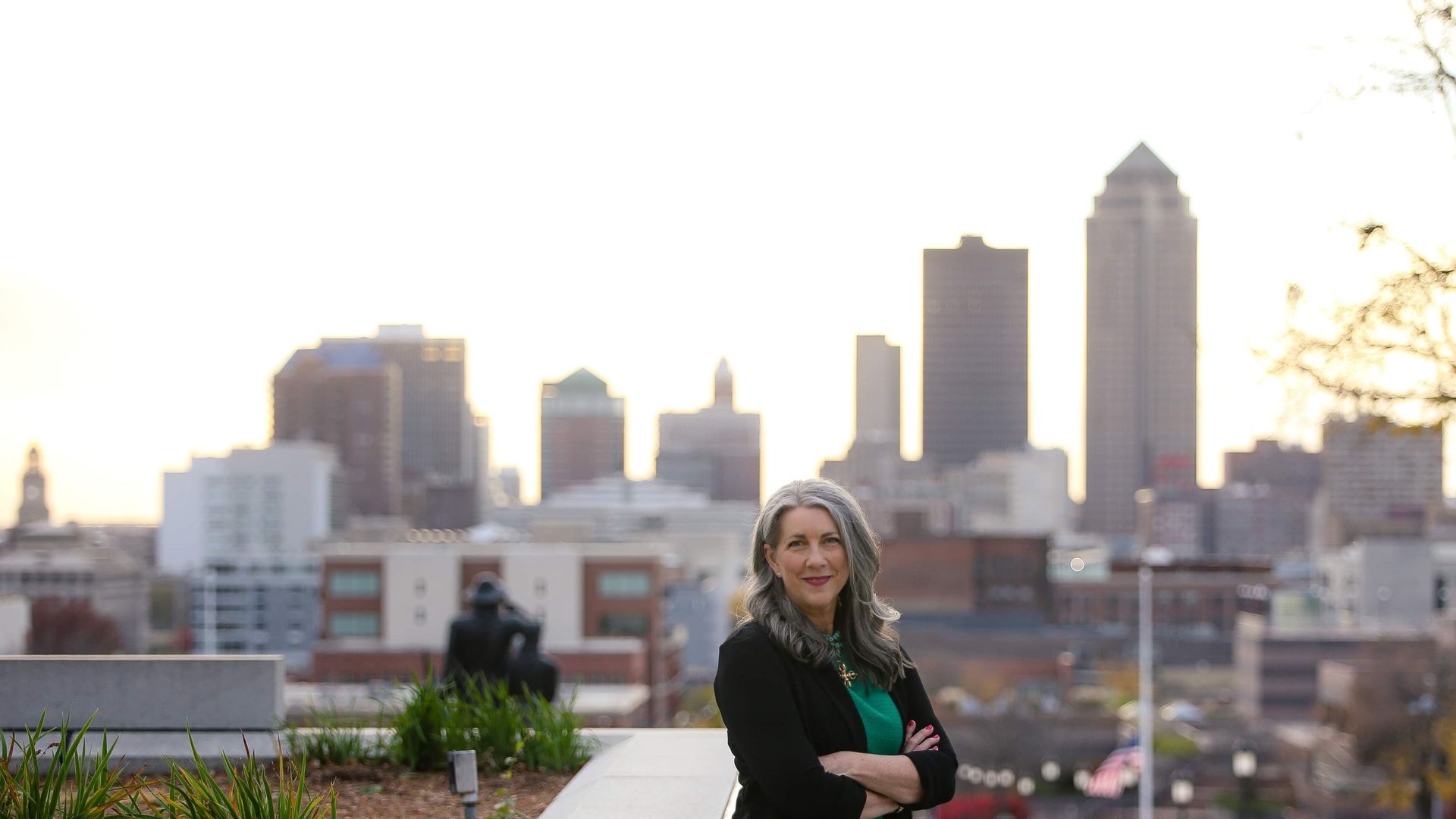 Kimberly Graham in front of the Des Moines skyline.