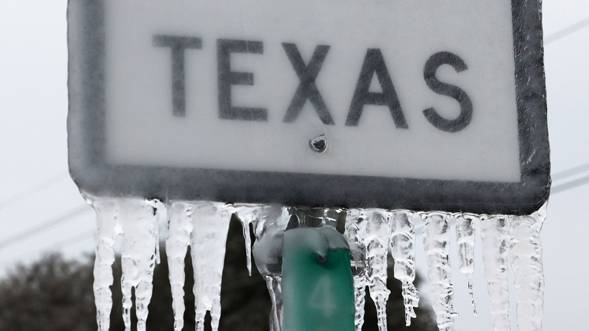 Icicles hang off the State Highway 195 sign yesterday in Killeen, Texas.