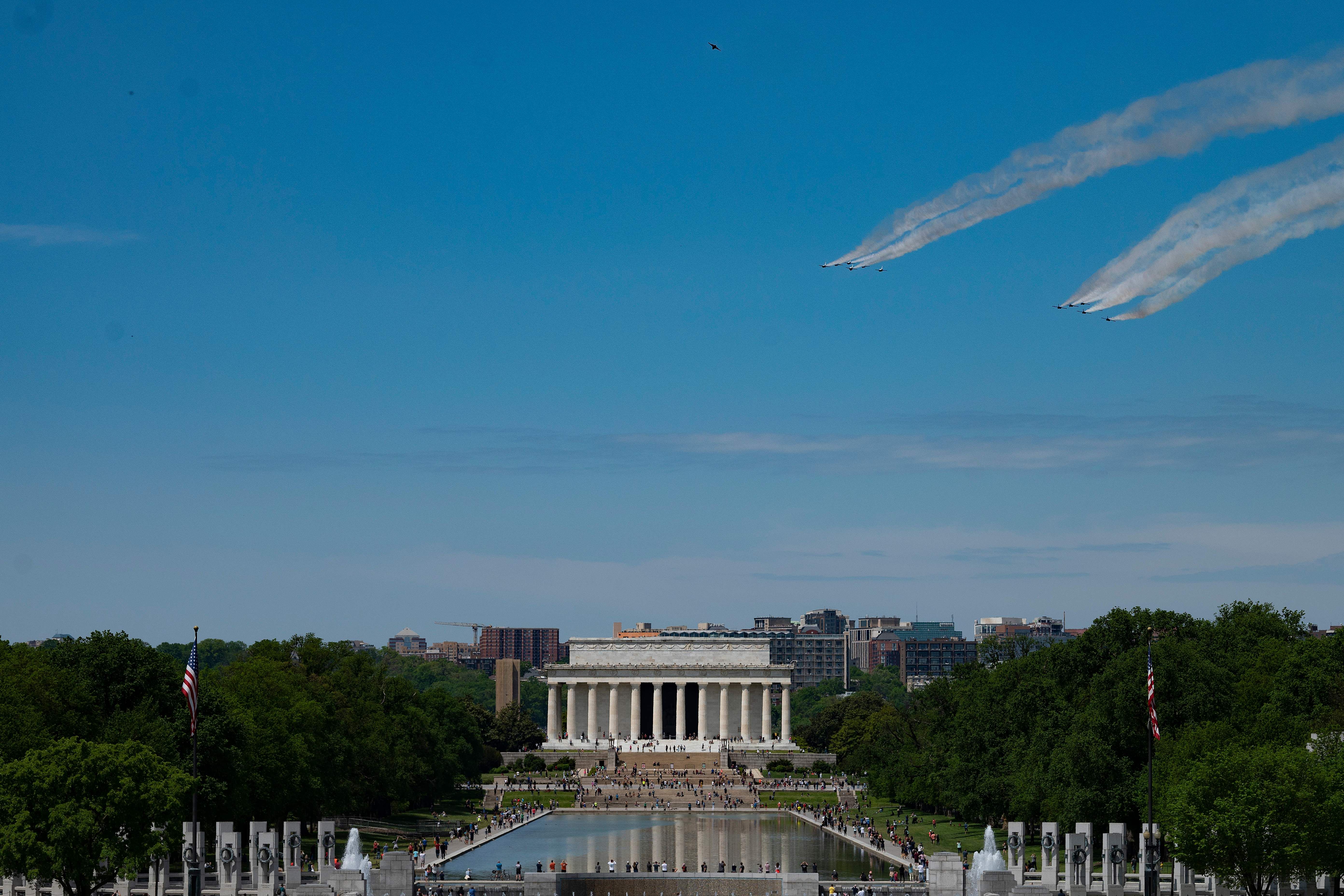 The planes fly over the Reflecting Pool in the national mall