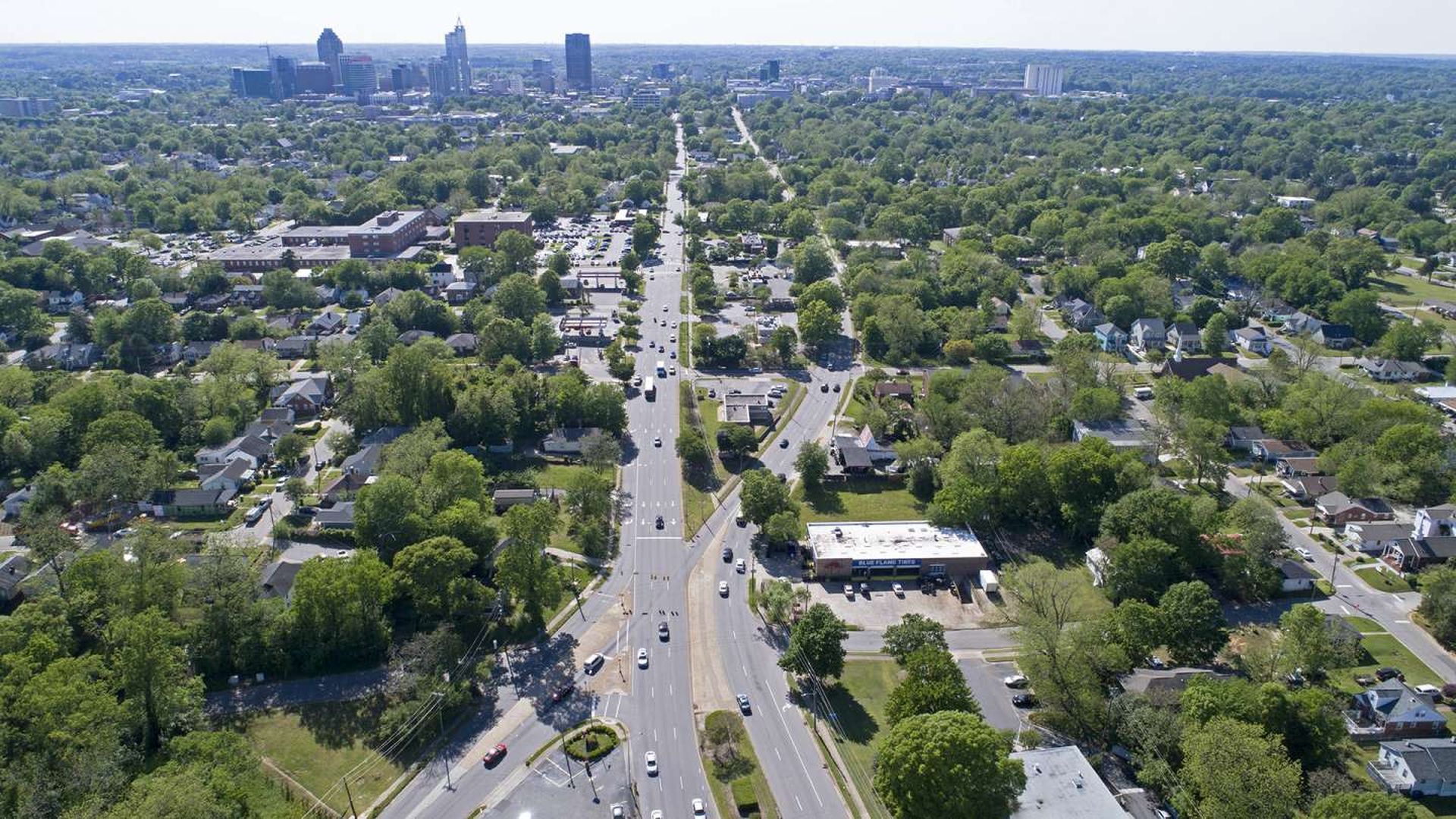 A drone shot above New Bern Avenue in downtown Raleigh