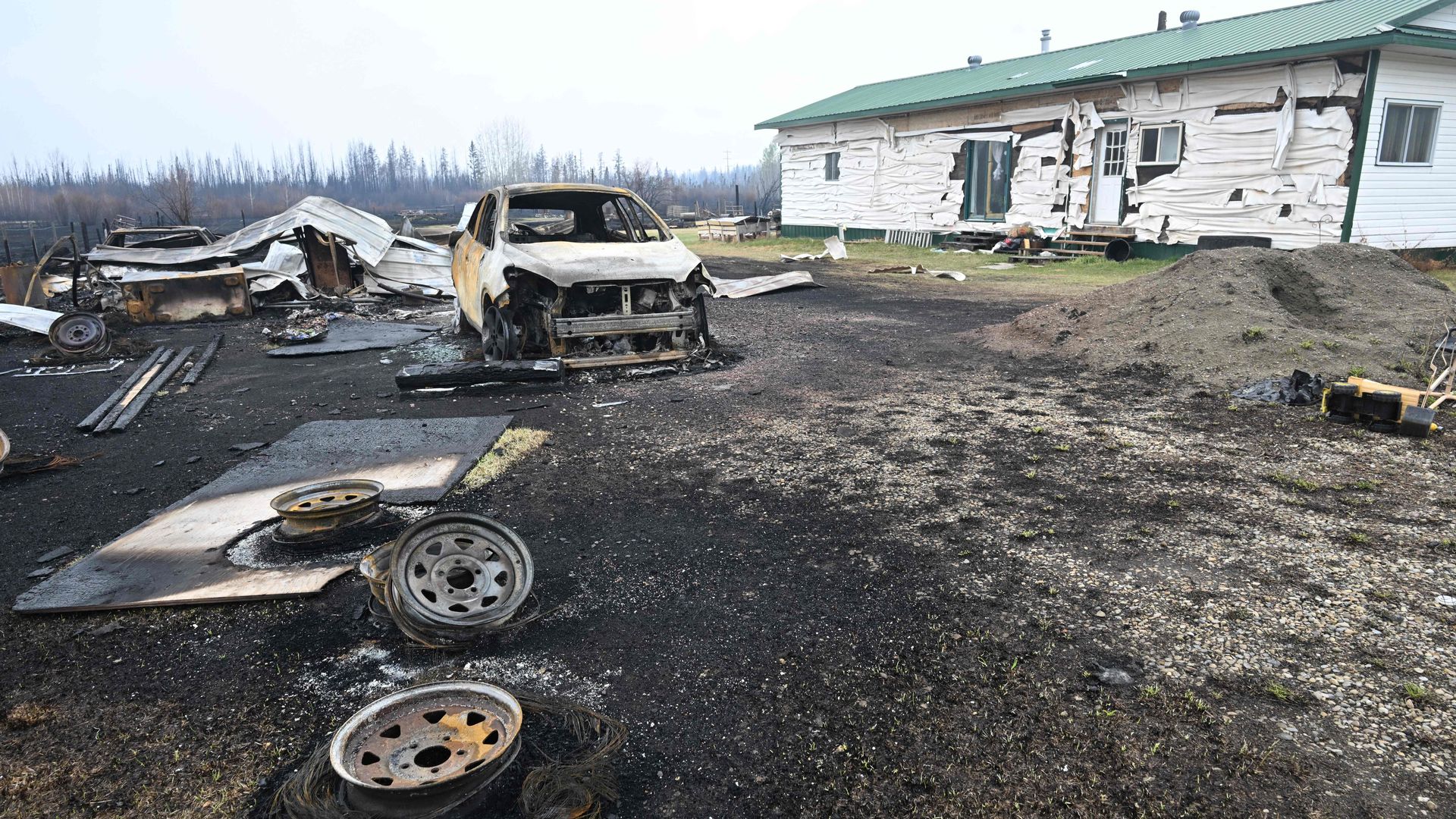 Damage is seen on the property of Adam Norris in Drayton Valley, Alberta, Canada, on May 8.