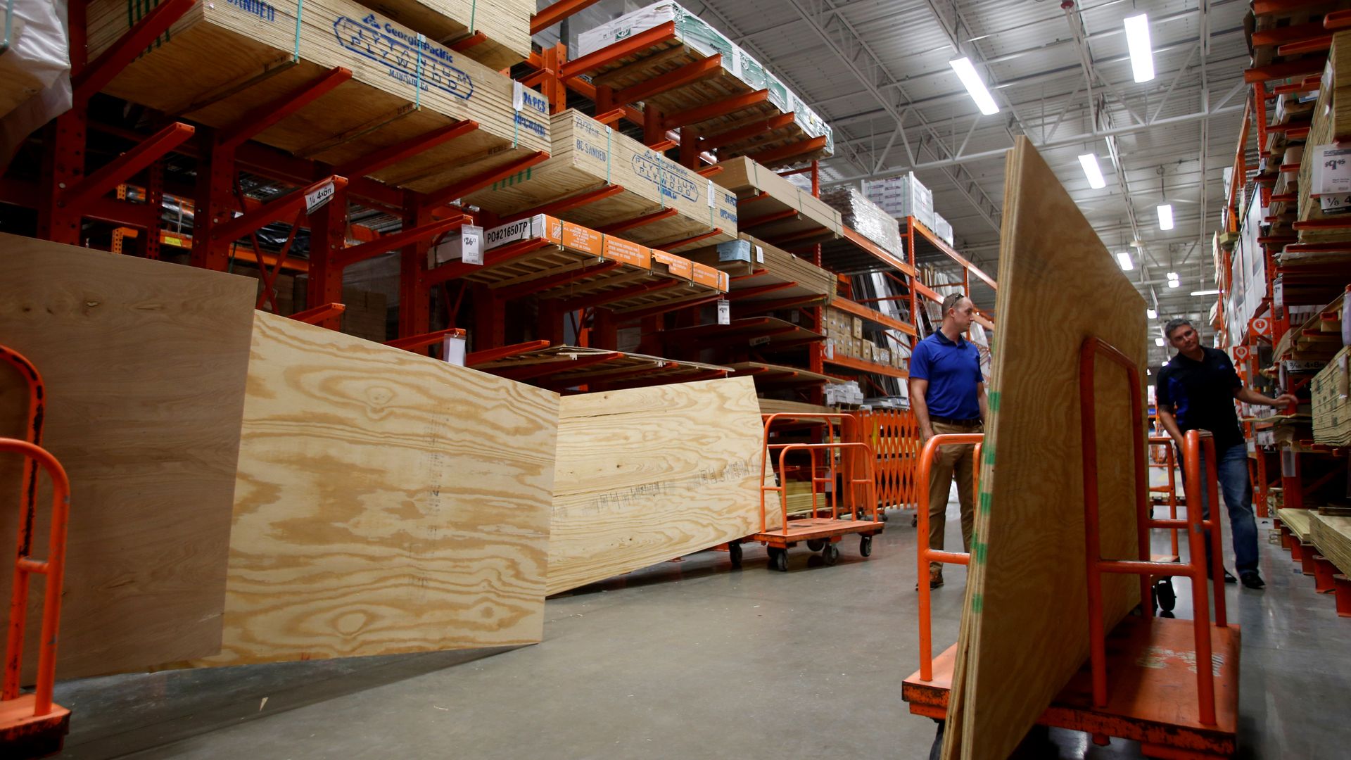 Home depot shelves with stacks of plywood
