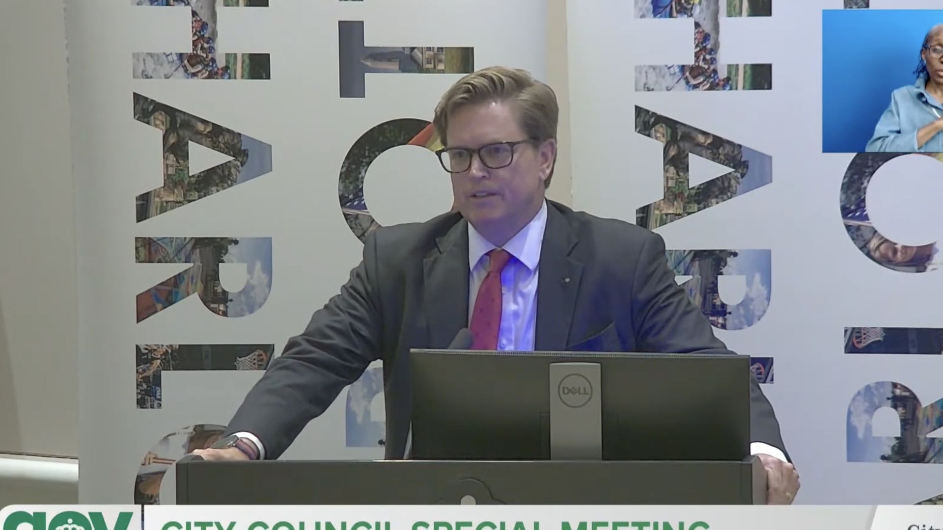 Edwin speaks at the podium