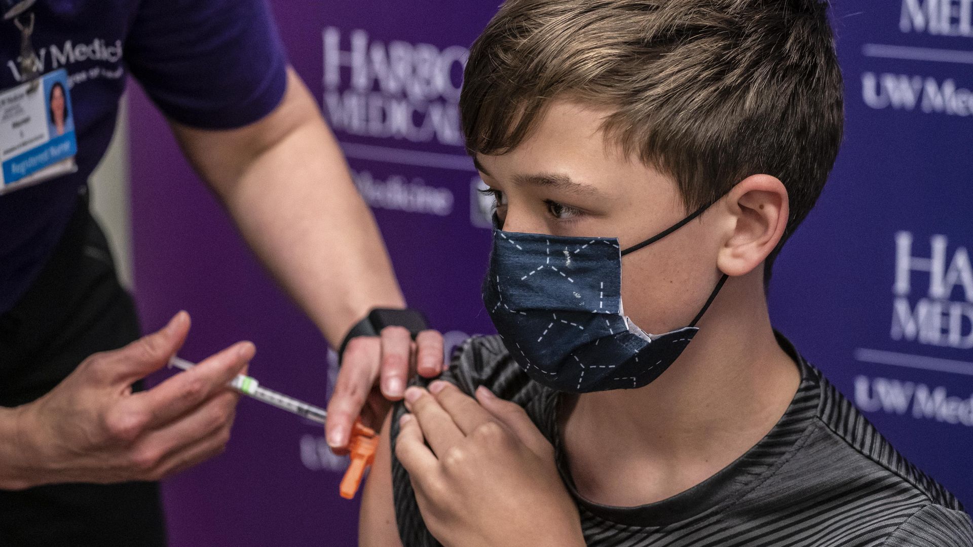 Picture of a kid gettingvaccinated in Seattle