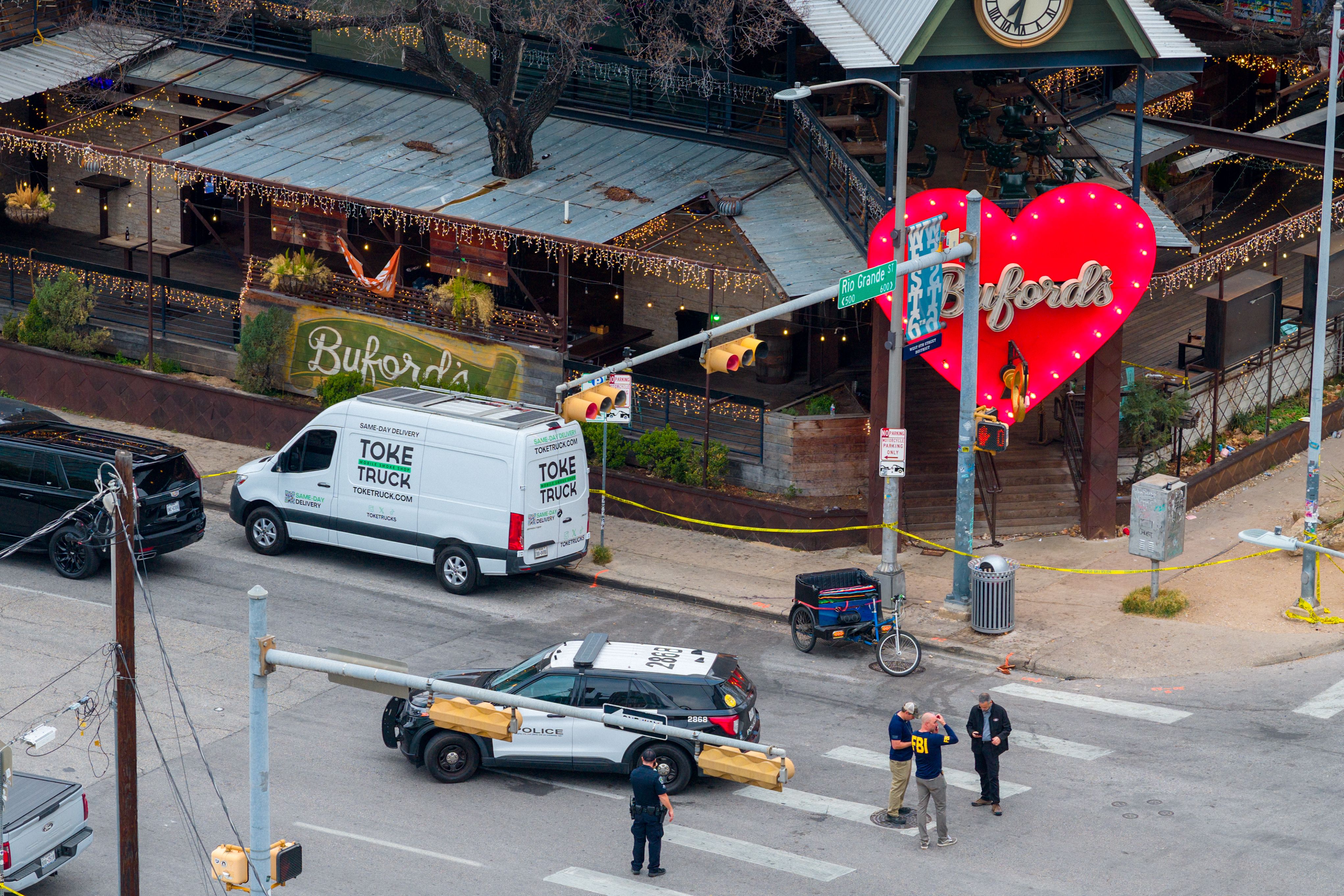 The FBI and local law enforcement investigate a mass shooting at Buford's bar in Austin, Texas, yesterday.