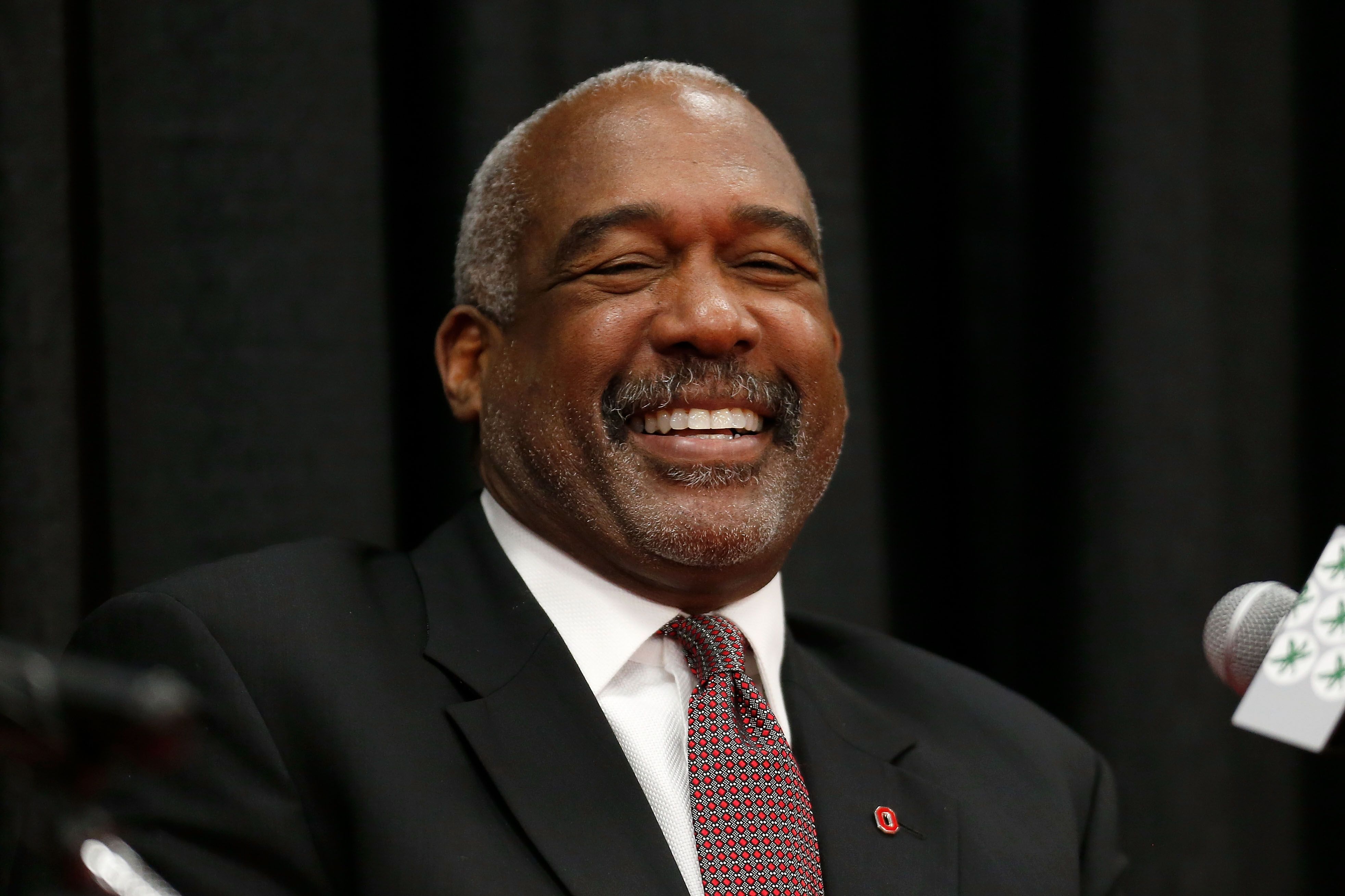 OSU athletic director Gene Smith laughing at a press conference.