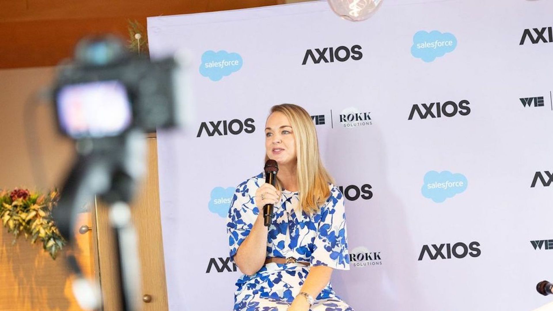 Photo of Dani Dudeck on stage at Axios event