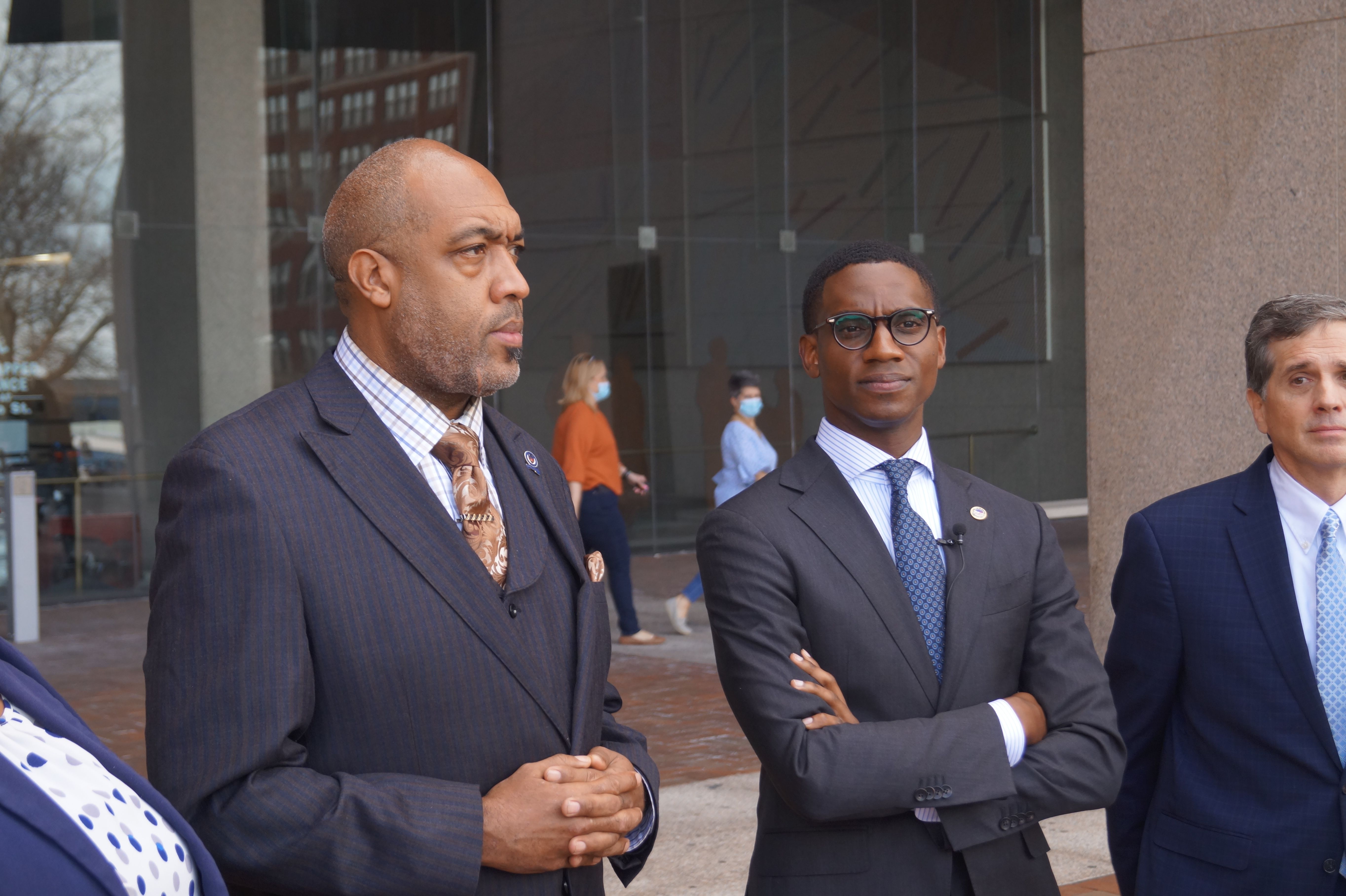 Griffin and Bibb in suits outside courthouse