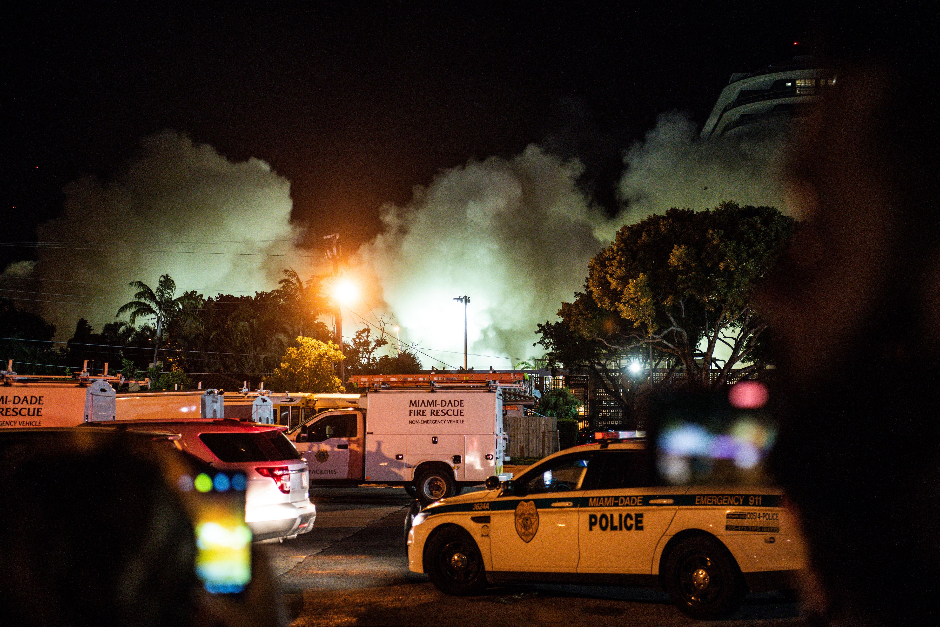 A cloud of dust is seen as the rest of the Champlain South tower is demolished by a controlled explosion in Surfside, Florida, north of Miami Beach, late on July 4