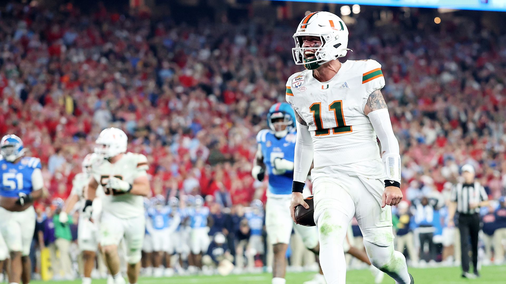 GLENDALE, ARIZONA - JANUARY 08: Carson Beck #11 of the Miami Hurricanes scores a touchdown against the Ole Miss Rebels in the fourth quarter during the 2025 College Football Playoff Semifinal at the VRBO Fiesta Bowl at State Farm Stadium on January 08, 2026 in Glendale, Arizona. (Photo by Christian 