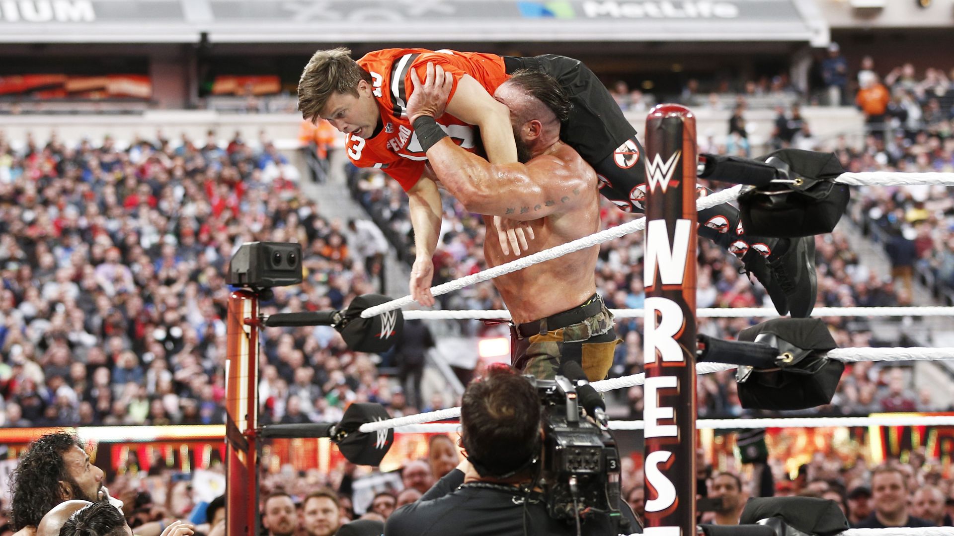 Colin Jost being thrown out of the ring