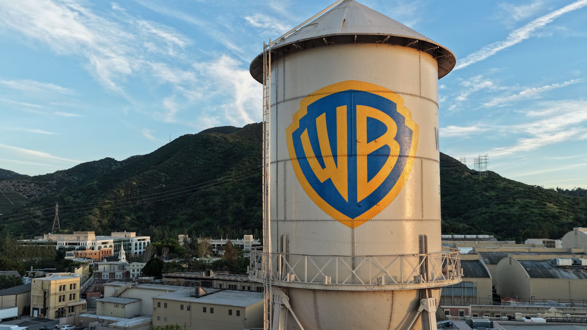 In an aerial view, the Warner Bros. logo is displayed on the water tower at Warner Bros. Studio on February 27, 2026 in Burbank, California. 
