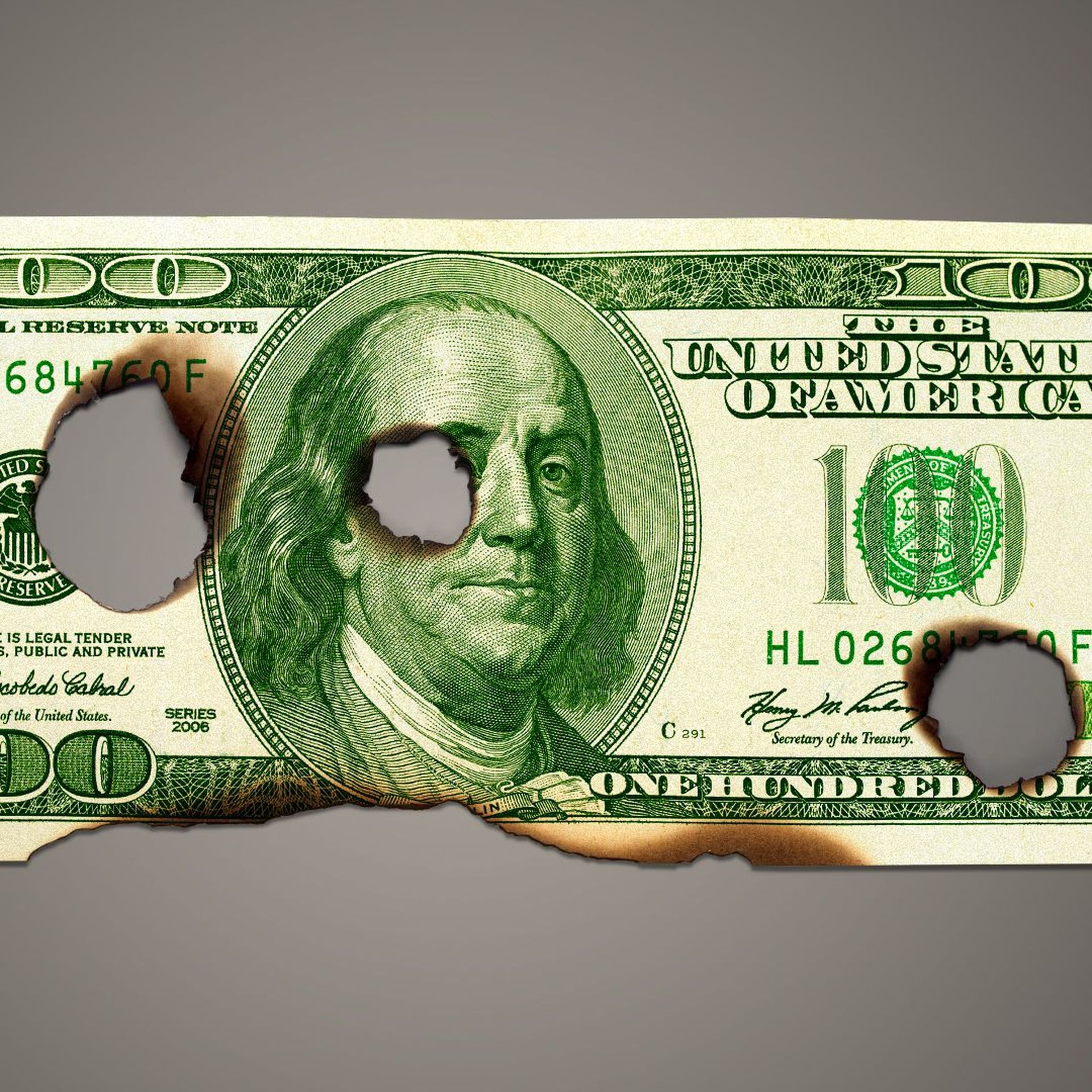 Illustration of a hundred dollar bill with burn holes and scorch marks. 
