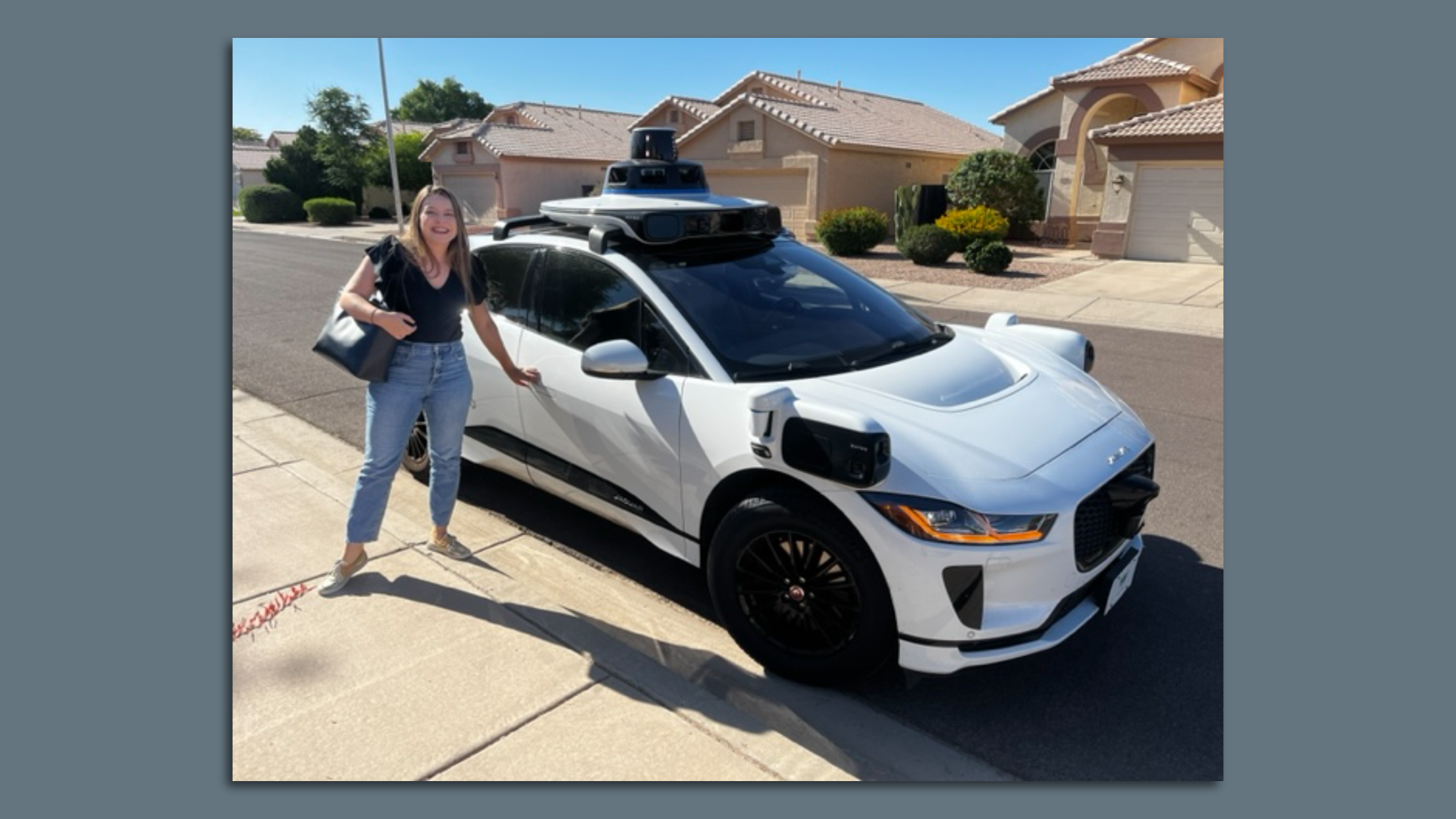 Jessica and a Waymo driverless car.