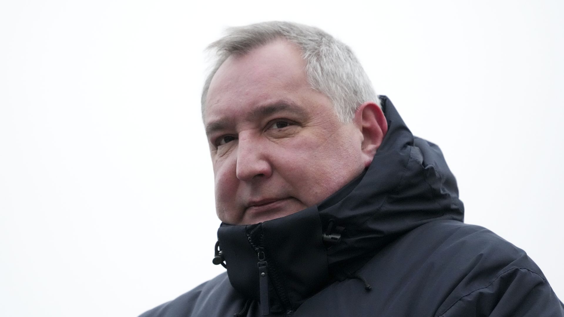 The head of Russia's Roscosmos space agency, Dmitry Rogozin, attends a report ceremony.