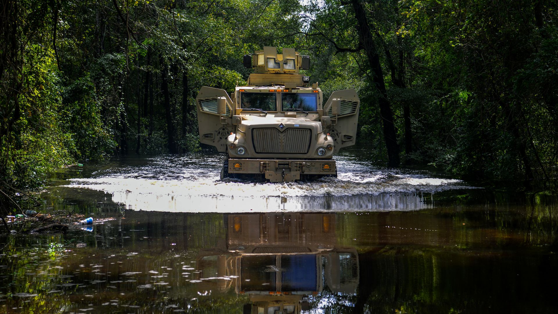 Photo of an Army vehicle in a large body of water