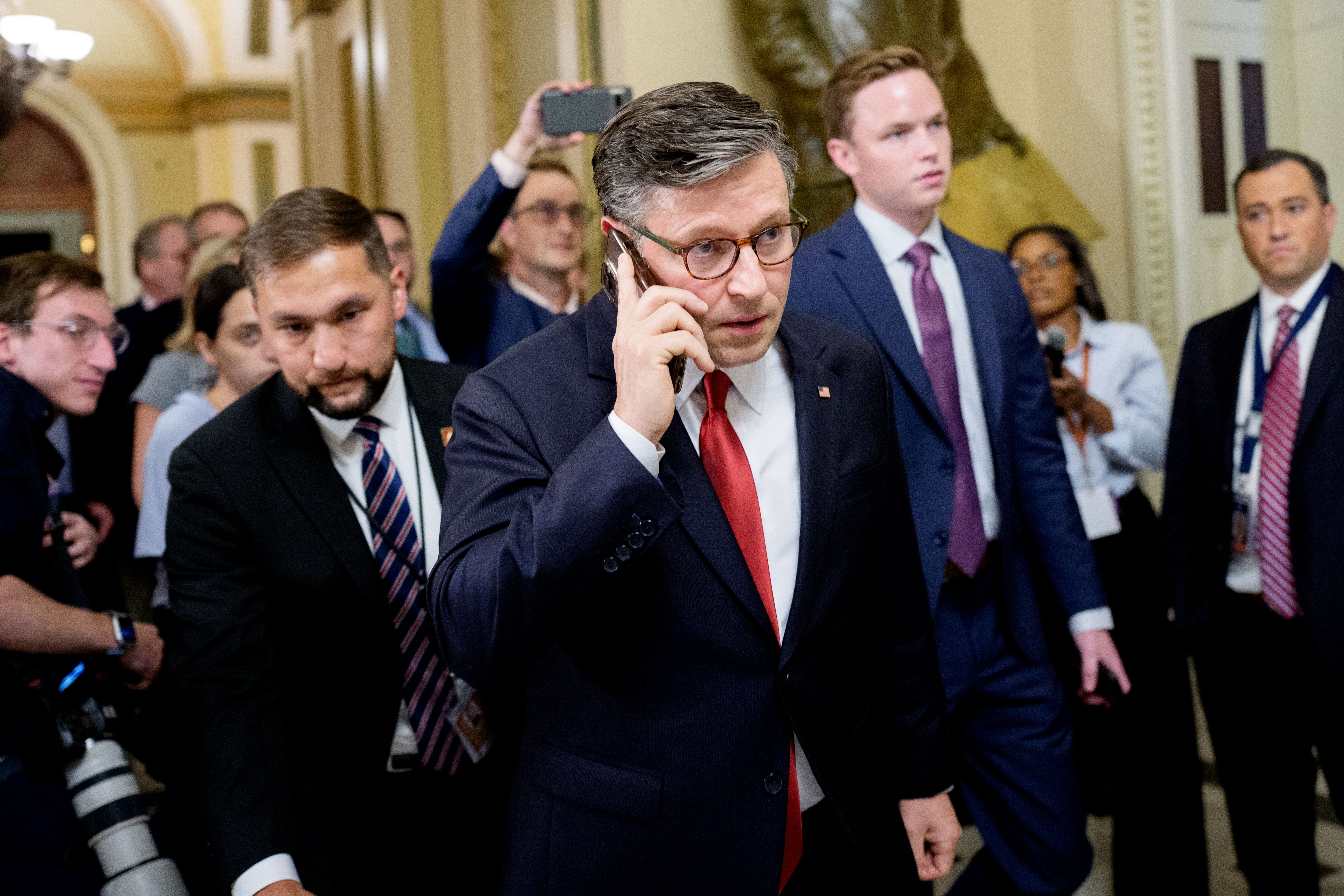 : Speaker of the House Mike Johnson (R-LA) walks to his office at the U.S. Capitol on July 02, 2025 in Washington, DC. Johnson, U.S. President Donald Trump and other Republicans are working to gather enough support to begin debate on Trump's sweeping tax and spending bill, which was passed by the Se