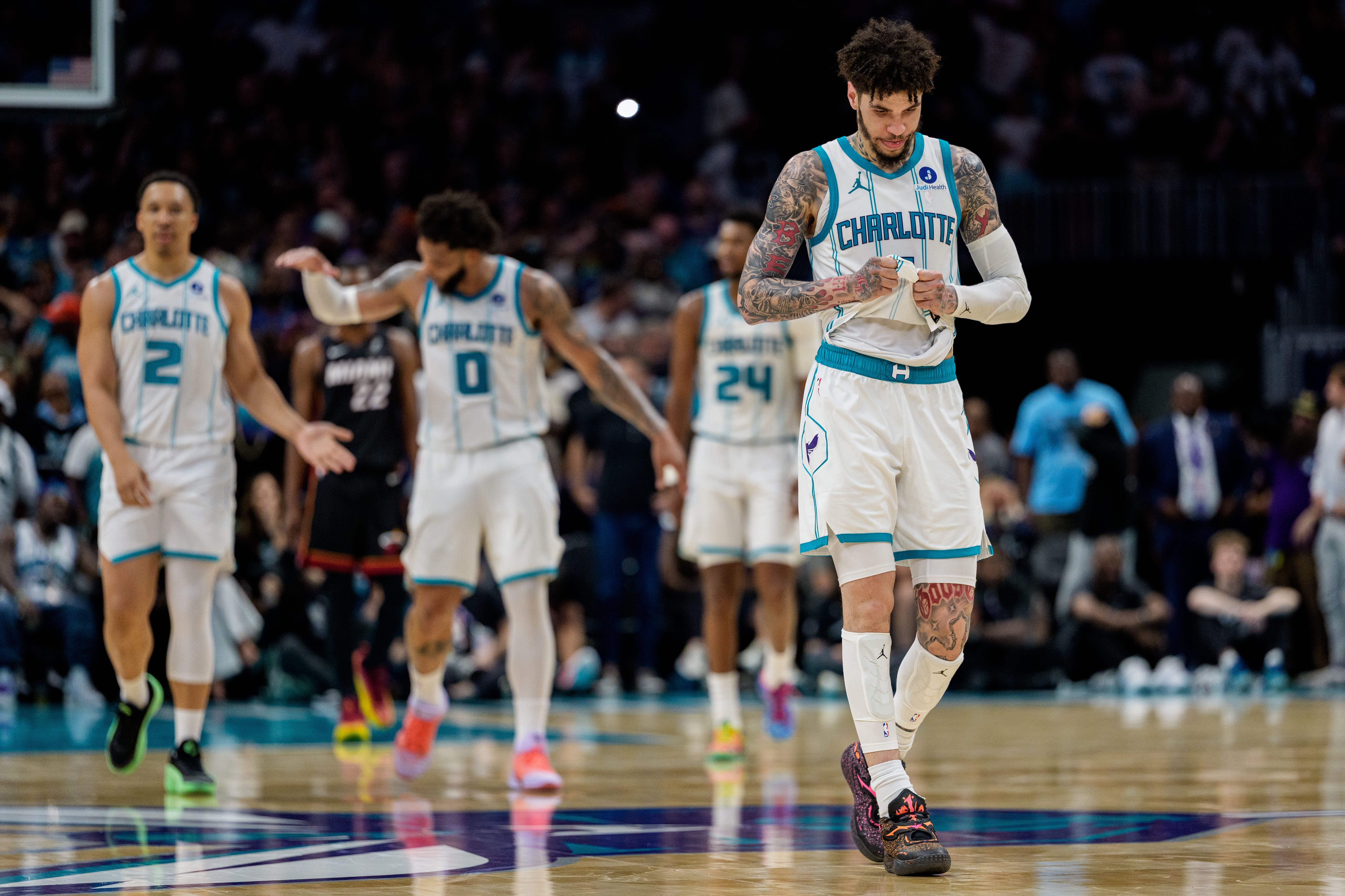 CHARLOTTE, NORTH CAROLINA - APRIL 14: (L-R) Grant Williams #2, Miles Bridges #0, Brandon Miller #24, and LaMelo Ball #1 of the Charlotte Hornets look on in the second half against the Miami Heat during their game at Spectrum Center on April 14, 2026 in Charlotte, North Carolina. NOTE TO USER: User e