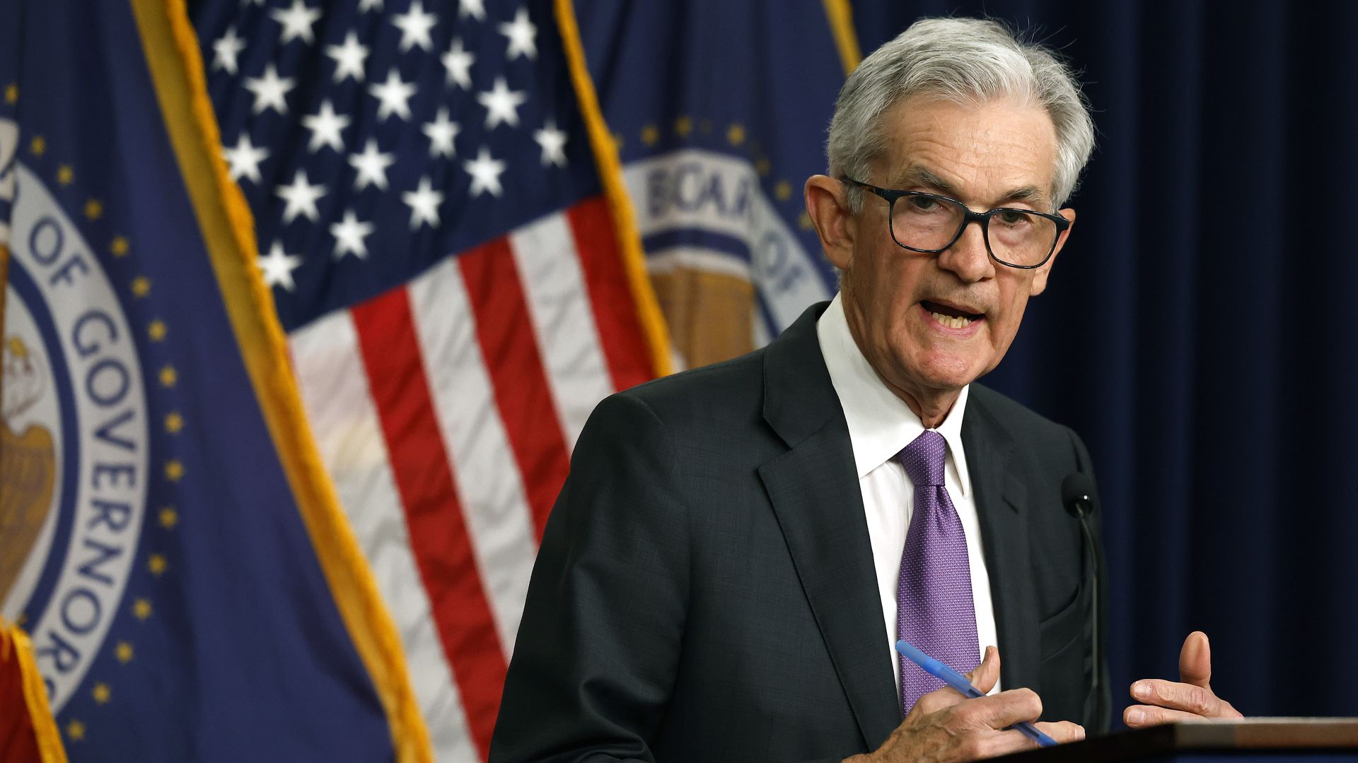 Fed Chair Jerome Powell speaking at a press conference.