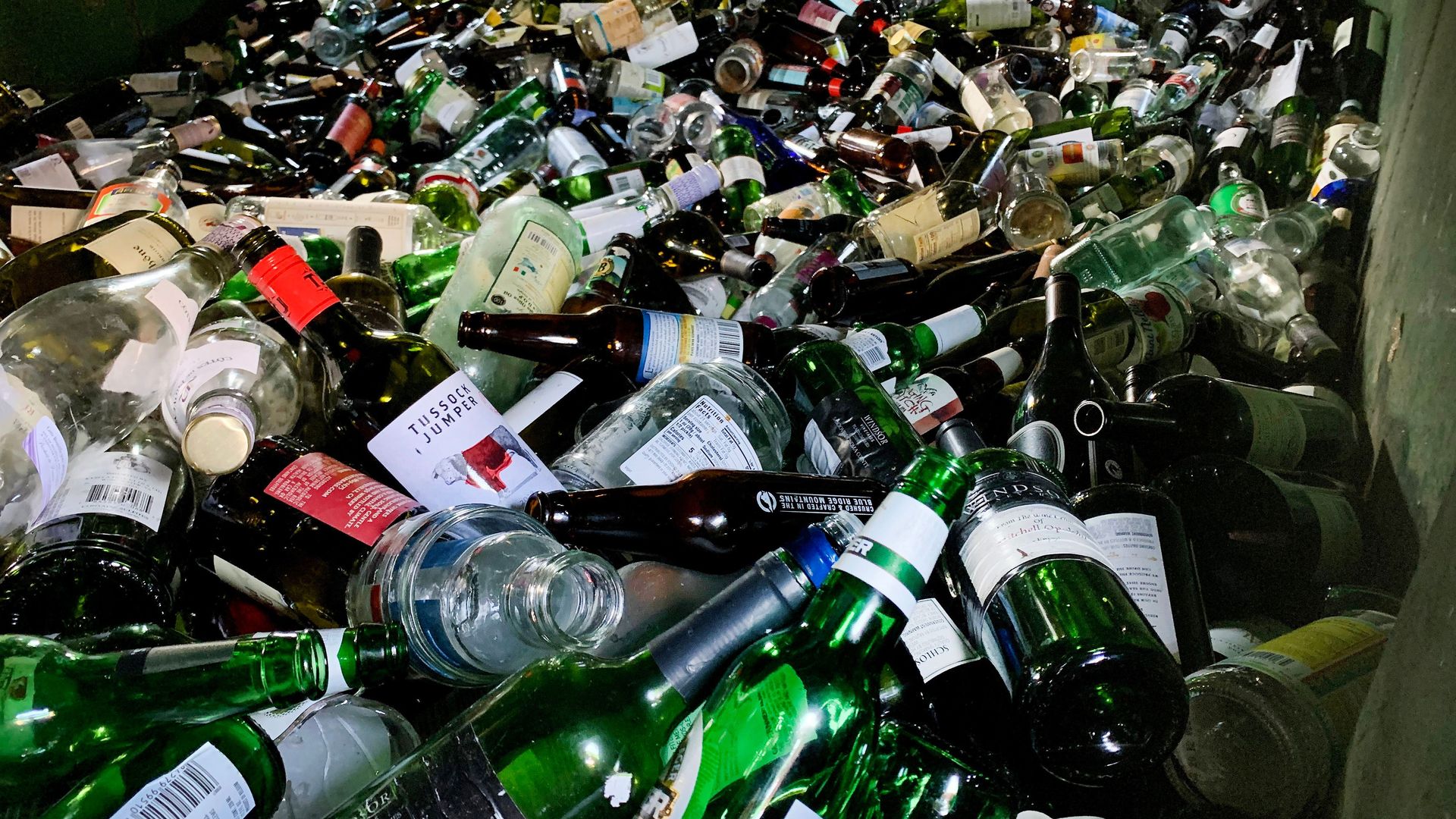 Empty glass bottles including those from wine and beer 