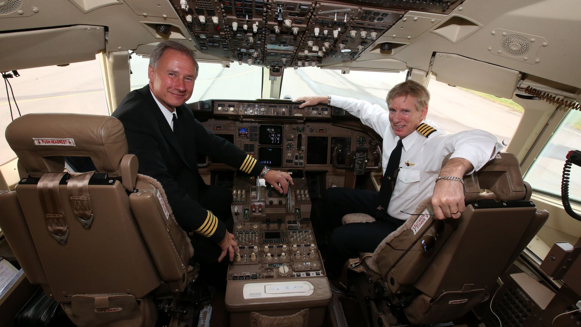 Pilots Captains John Dunkin (left) and Jay Galpin after flying Businessman American tycoon Donald Trump's private jet. (Photo by Andrew Milligan/PA Images via Getty Images)