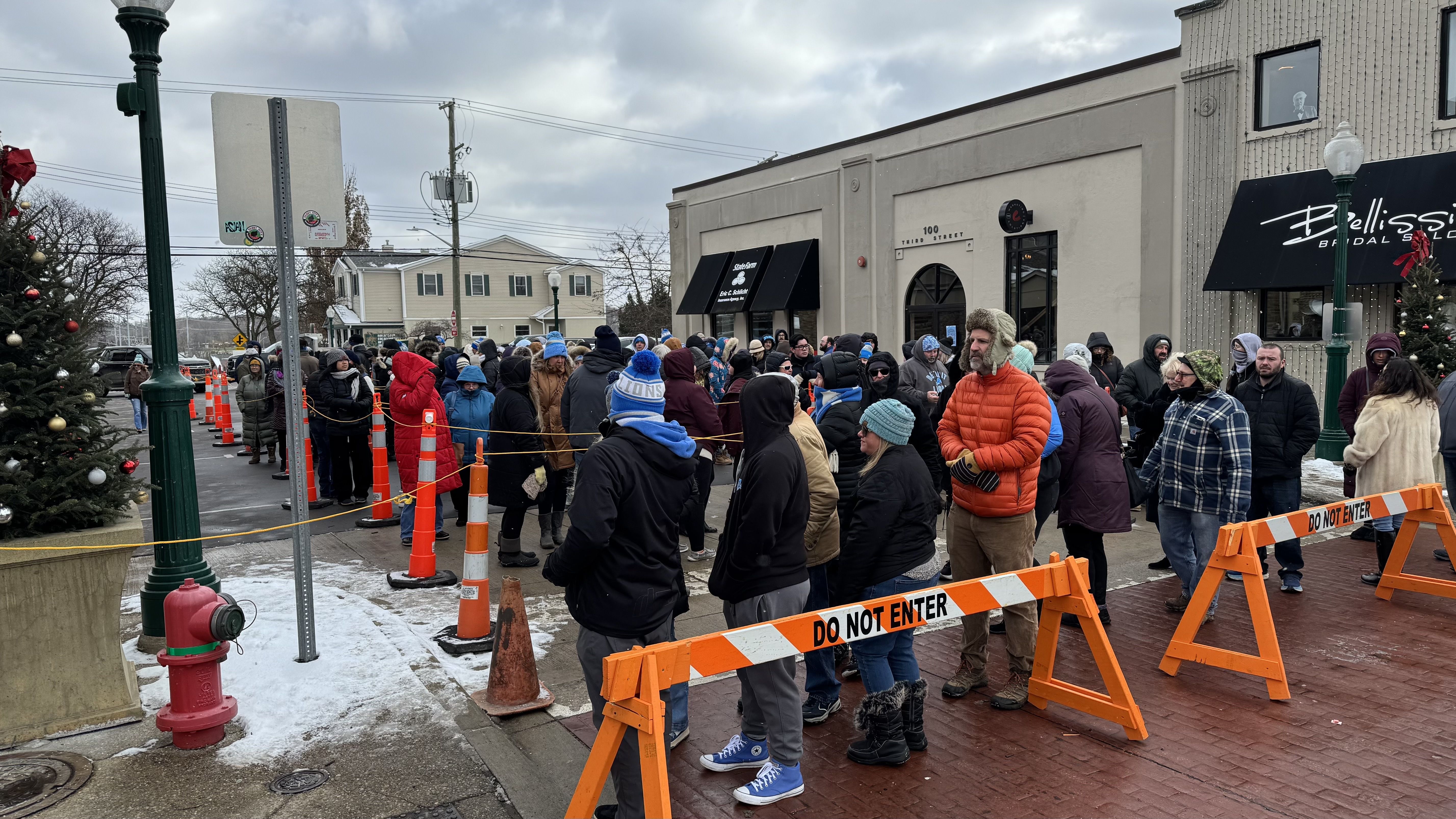 A long line waits to get into Home Bakery in Rochester.