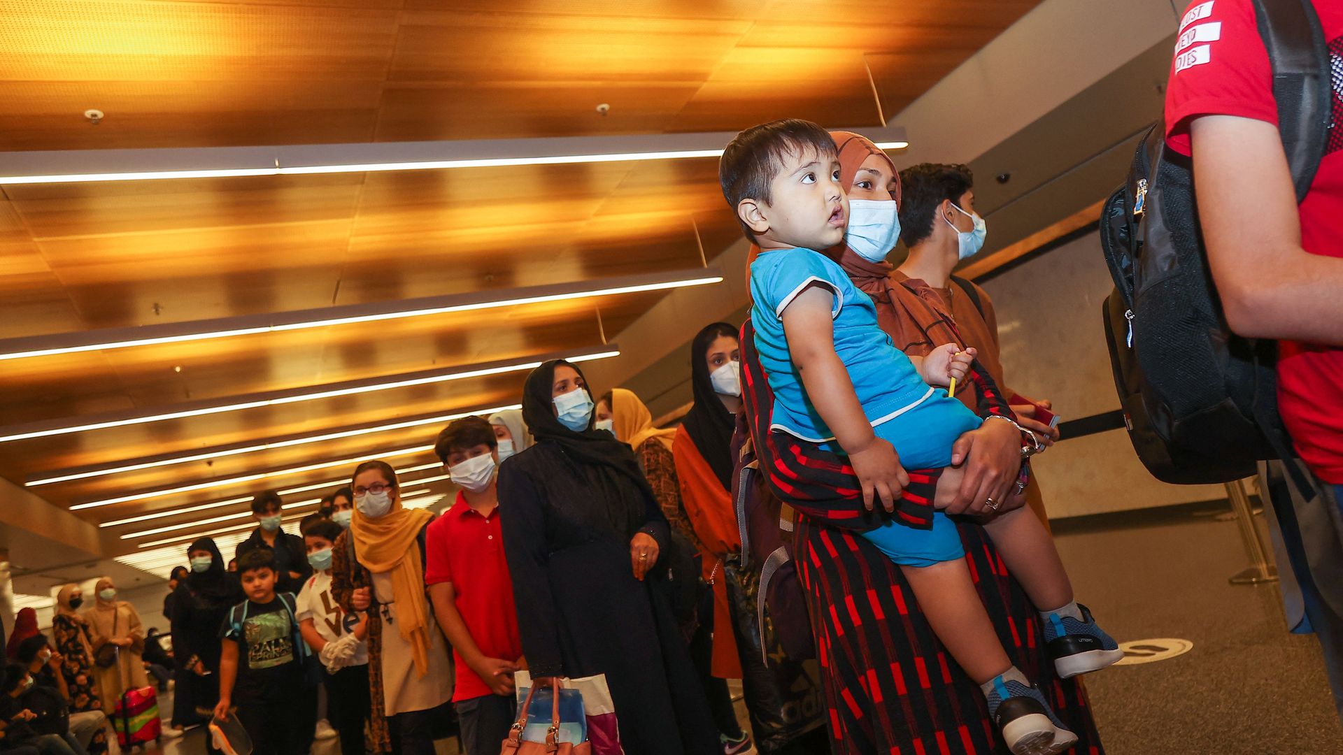 Evacuees from Afghanistan in an airport in Doha