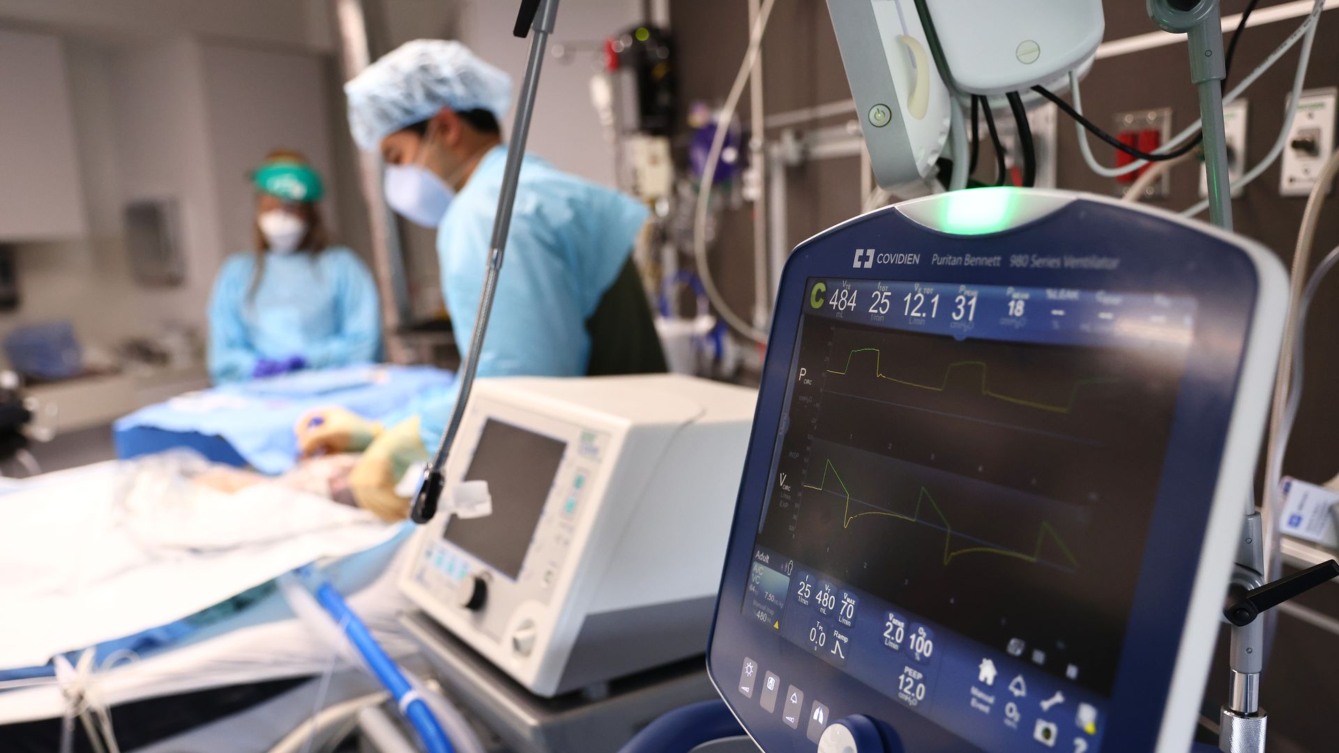 Clinicians care for a COVID-19 patient in the Intensive Care Unit (ICU) at Lake Charles Memorial Hospital on August 10, 2021 in Lake Charles, Louisiana.