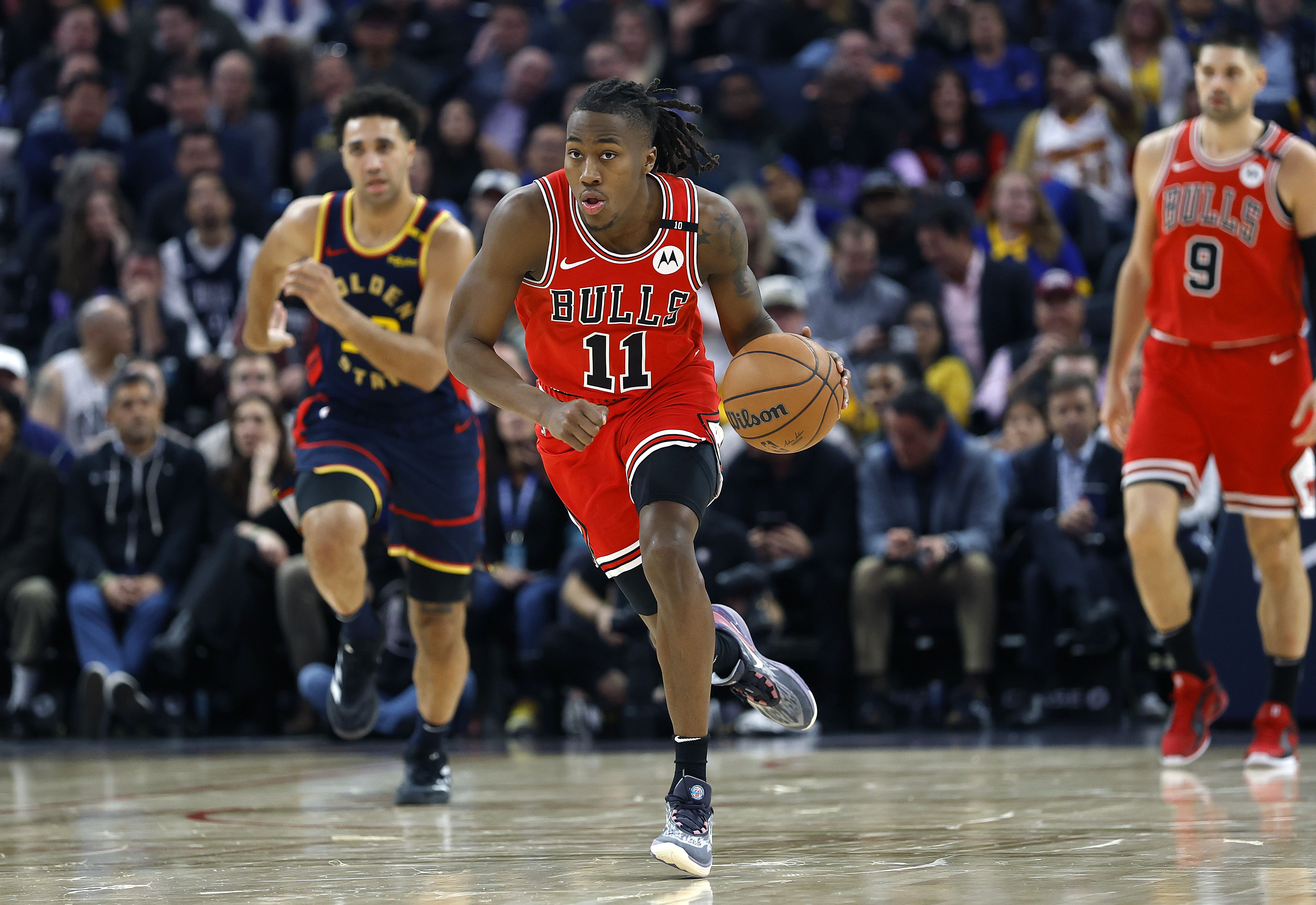Photo of a man dribbling a basketball 