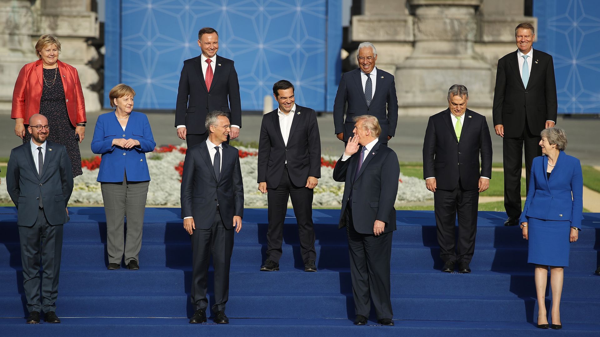 Trump stands for a photo with NATO leaders on steps