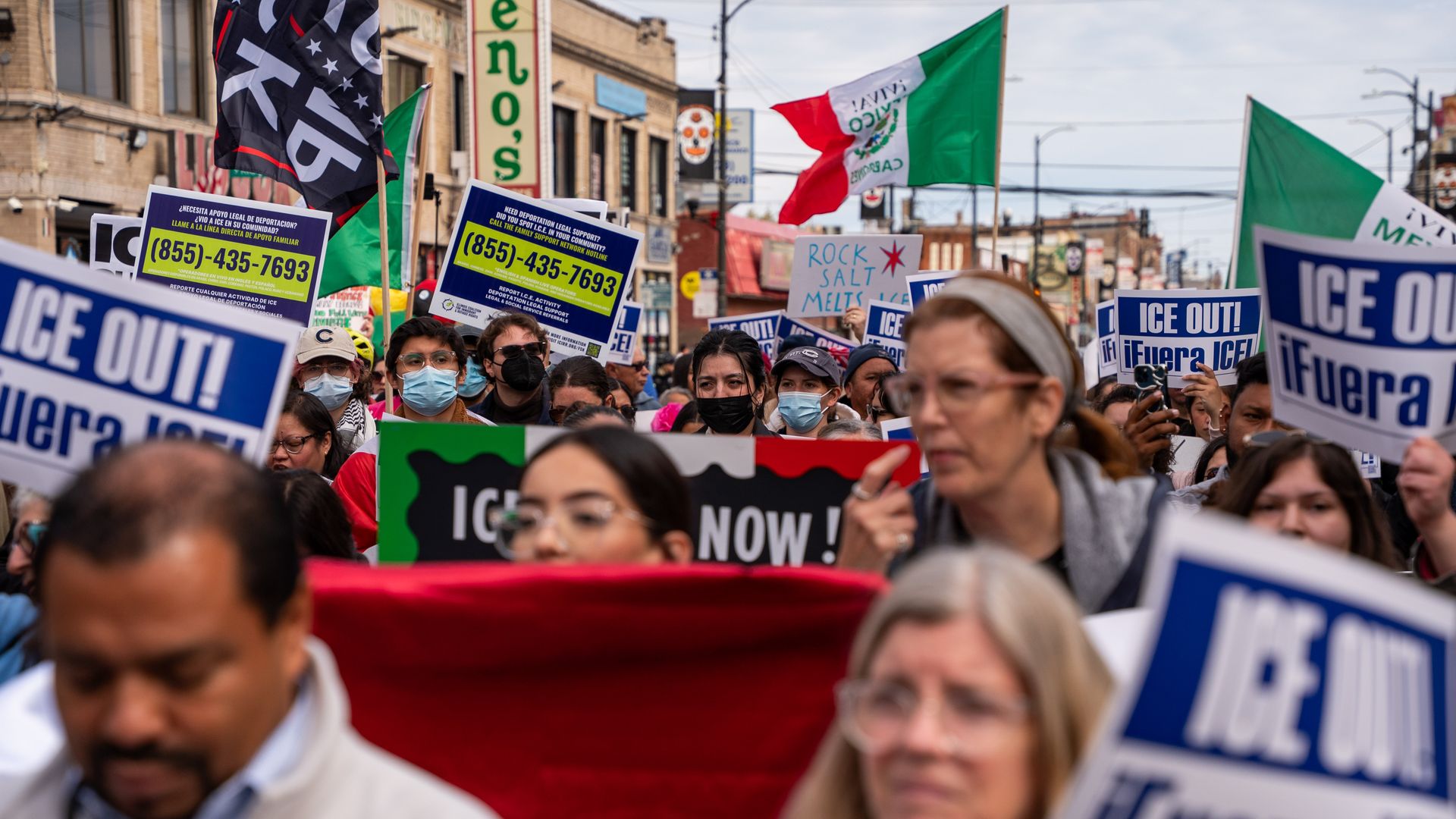 Protesters holding signs reading "ICE OUT!" and Mexican flags.