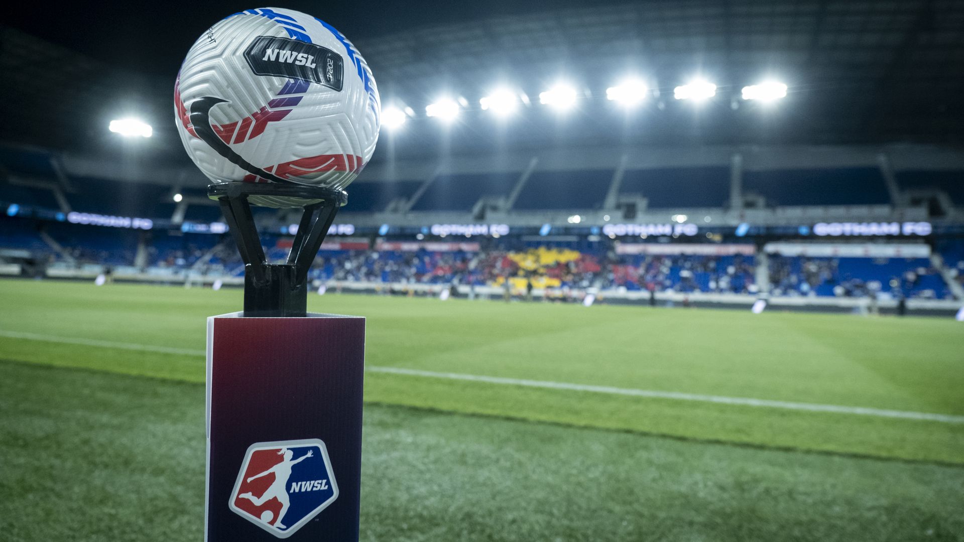 The official NWSL game ball sits on top of a pedestal with the NWSL Logo on it with the stadium behind the ball at the start of the National Women's Soccer League match