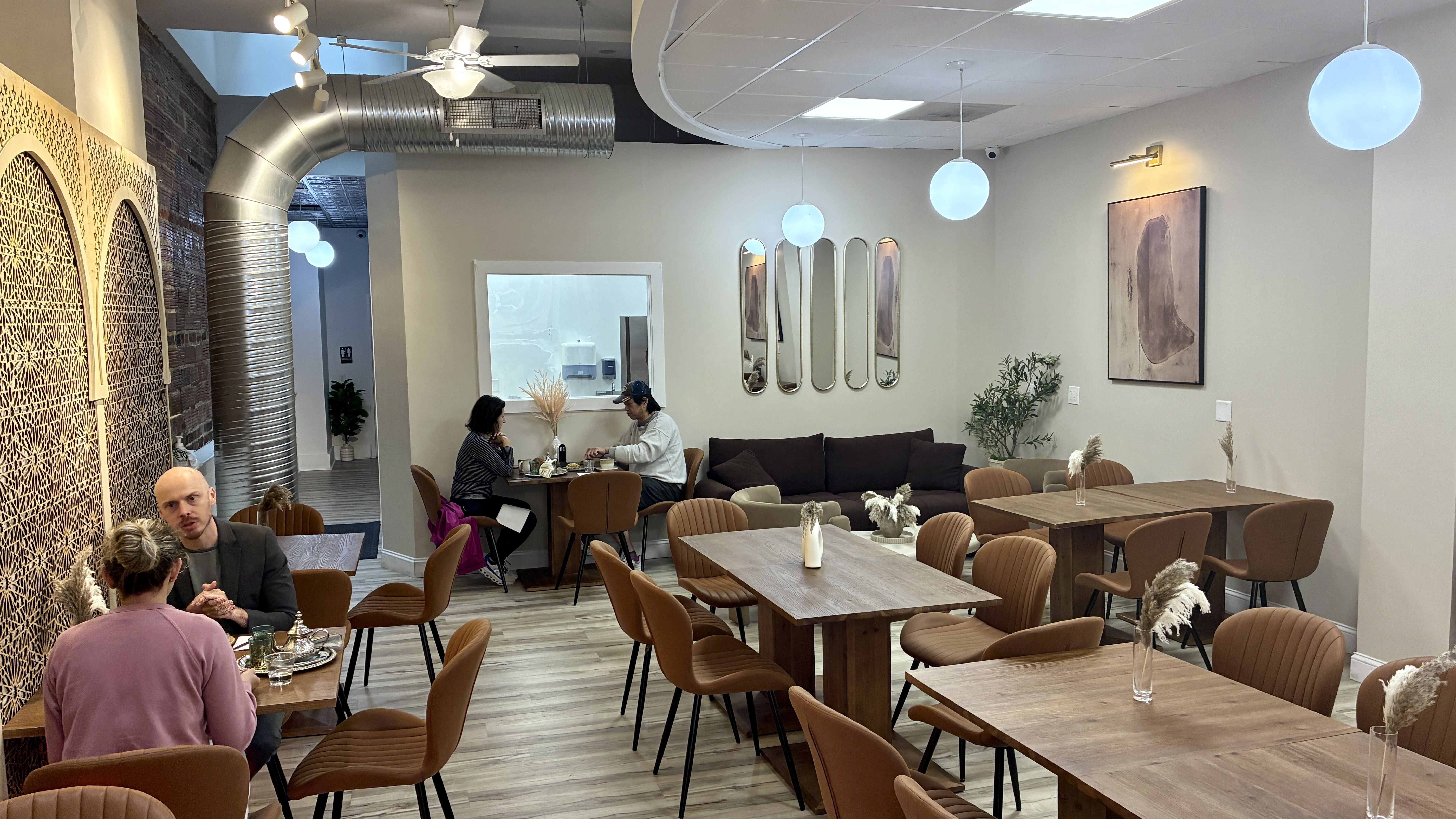 The dining room of Columbus' Maison Skalli feels more like a chill restaurant than a grab-and-go coffee shop.