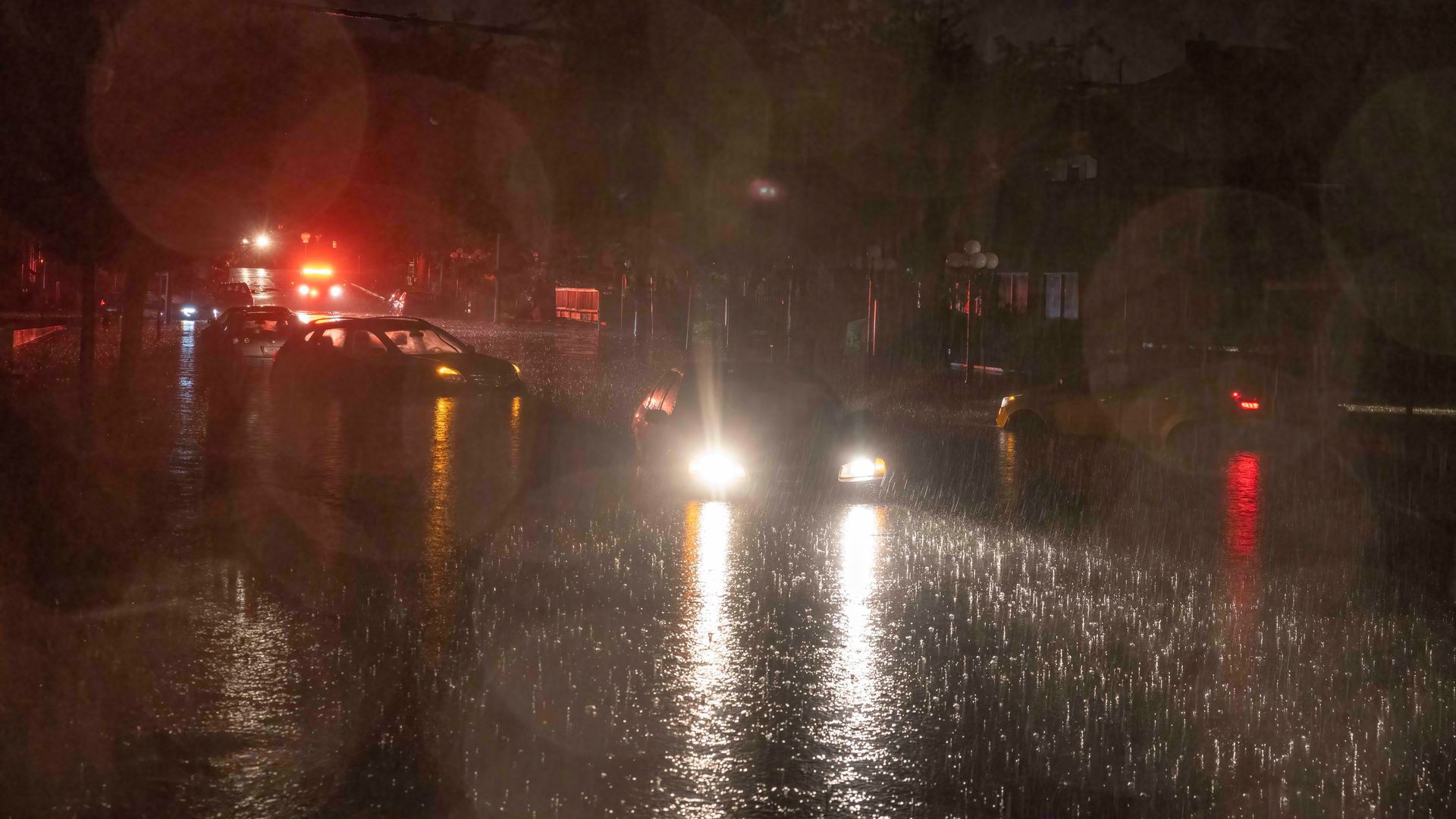Cars are stranded in water as Fourth Street is covered in water between Grant and Dunn after a flash flood Friday night, which left a large portion of downtown flooded