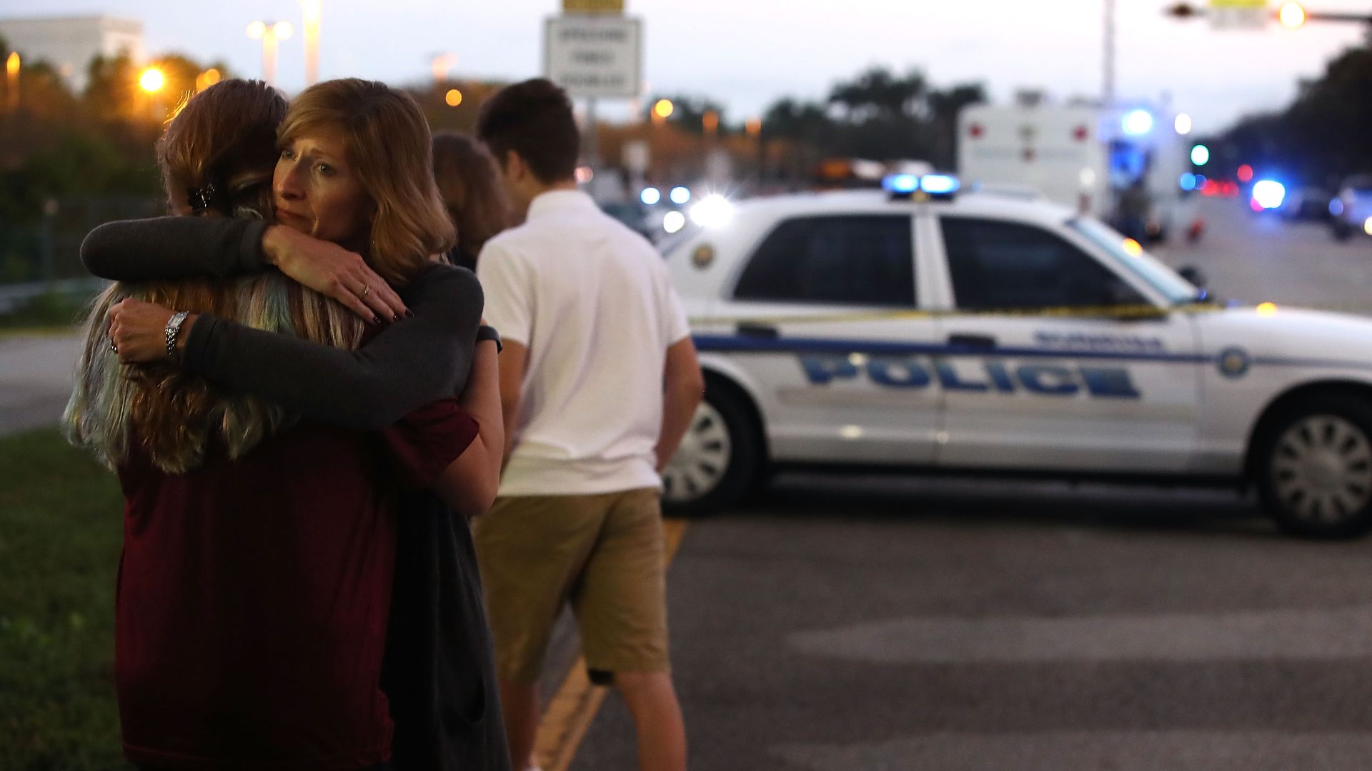 Woman hugs girl after Parkland shooting