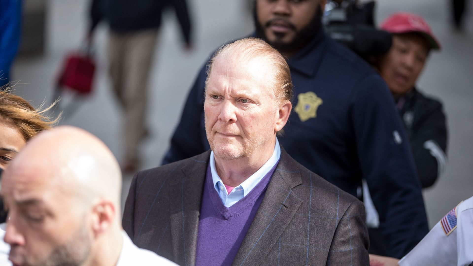 Celebrity chef Mario Batali leaves Boston Municipal Court following an arraingment on a charge of indecent assault and battery