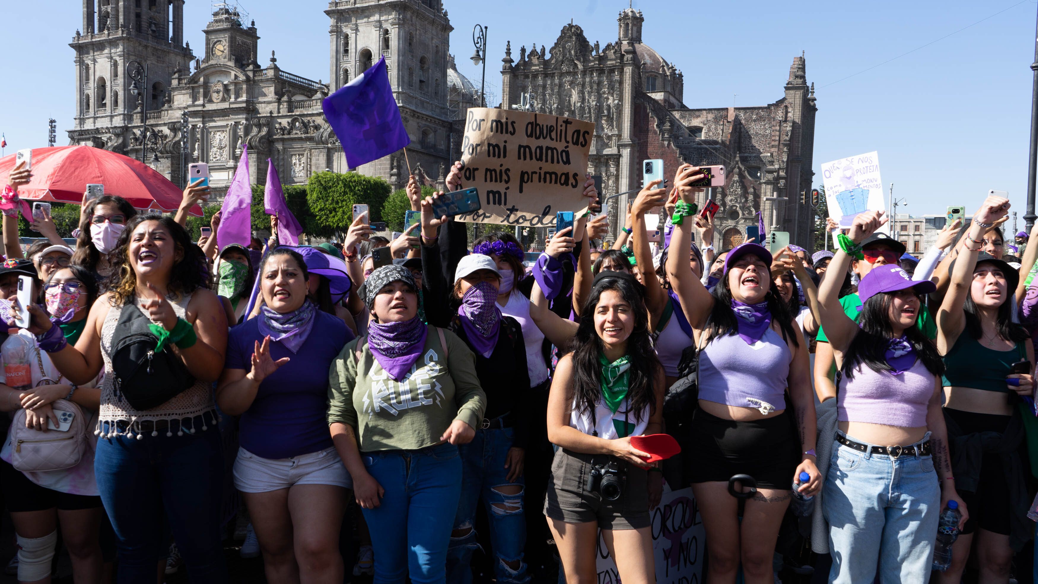 Women dressed in purple march on International Women's Day in Mexico City 