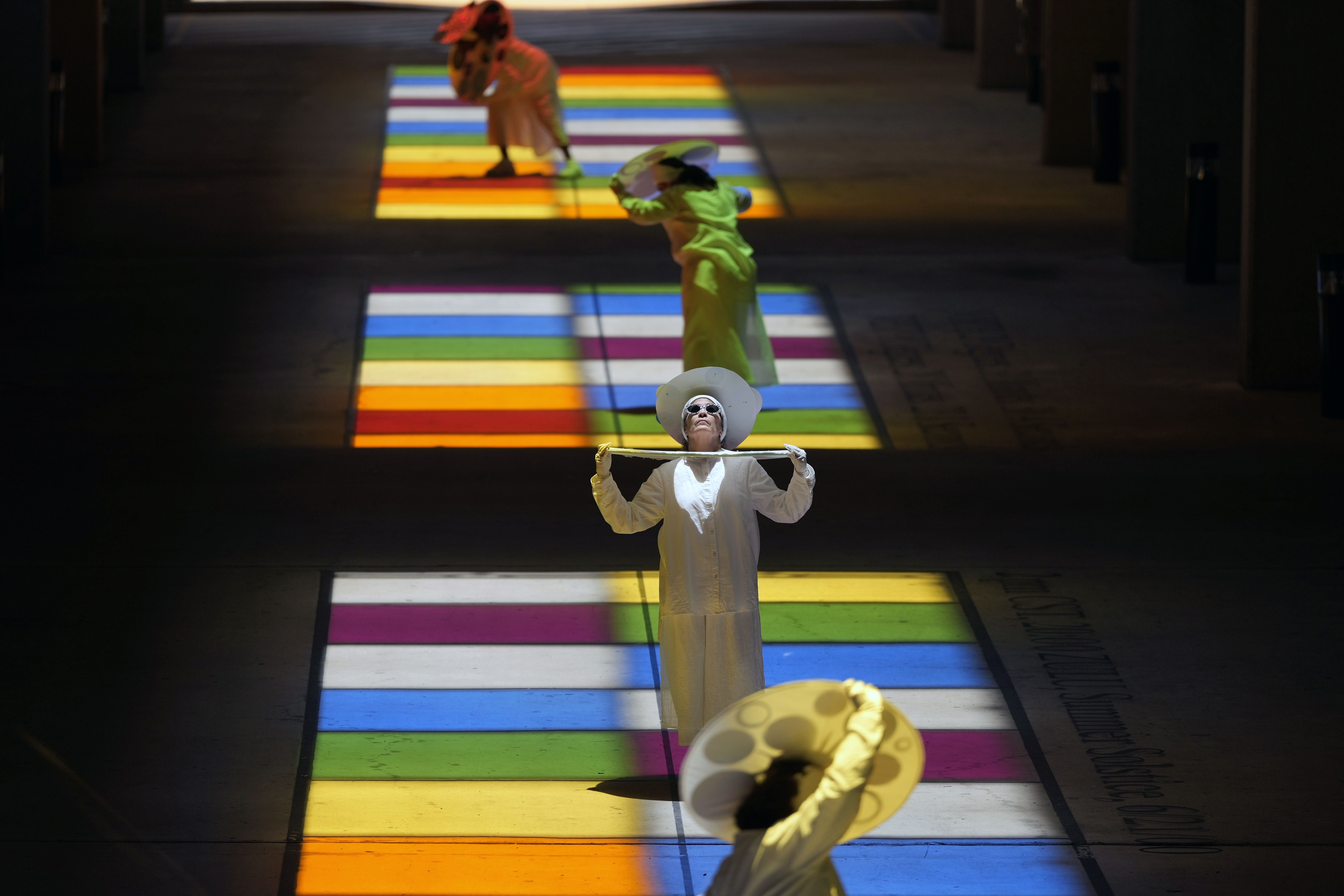 Dancers on brightly colored boxes